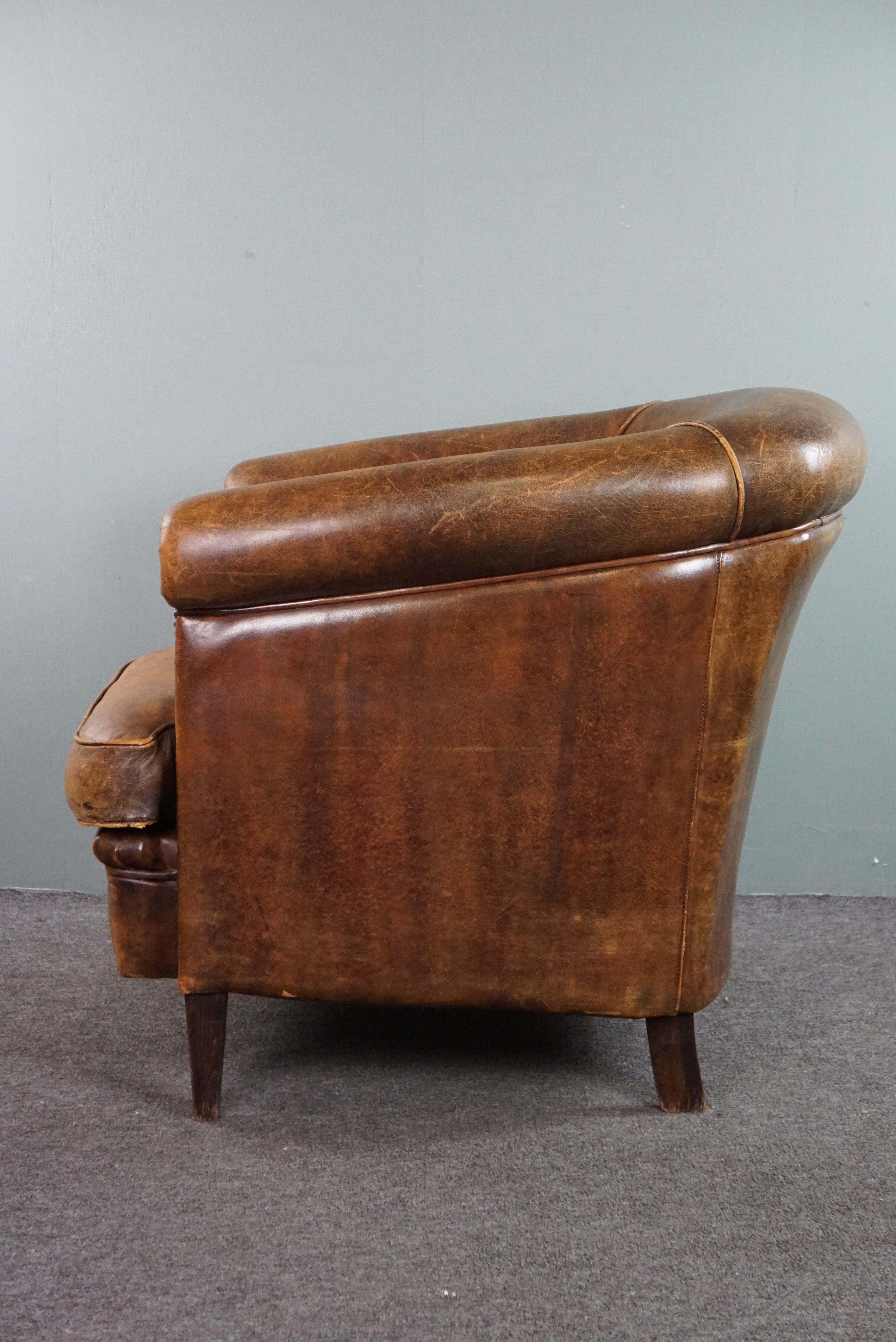 Late 20th Century Club armchair with patina, made of sheep leather For Sale
