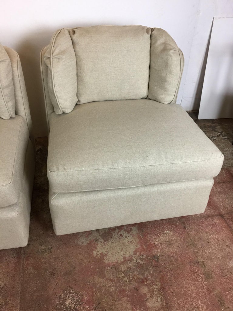 Pair of club chairs by Henredon. Upholstered in linen.