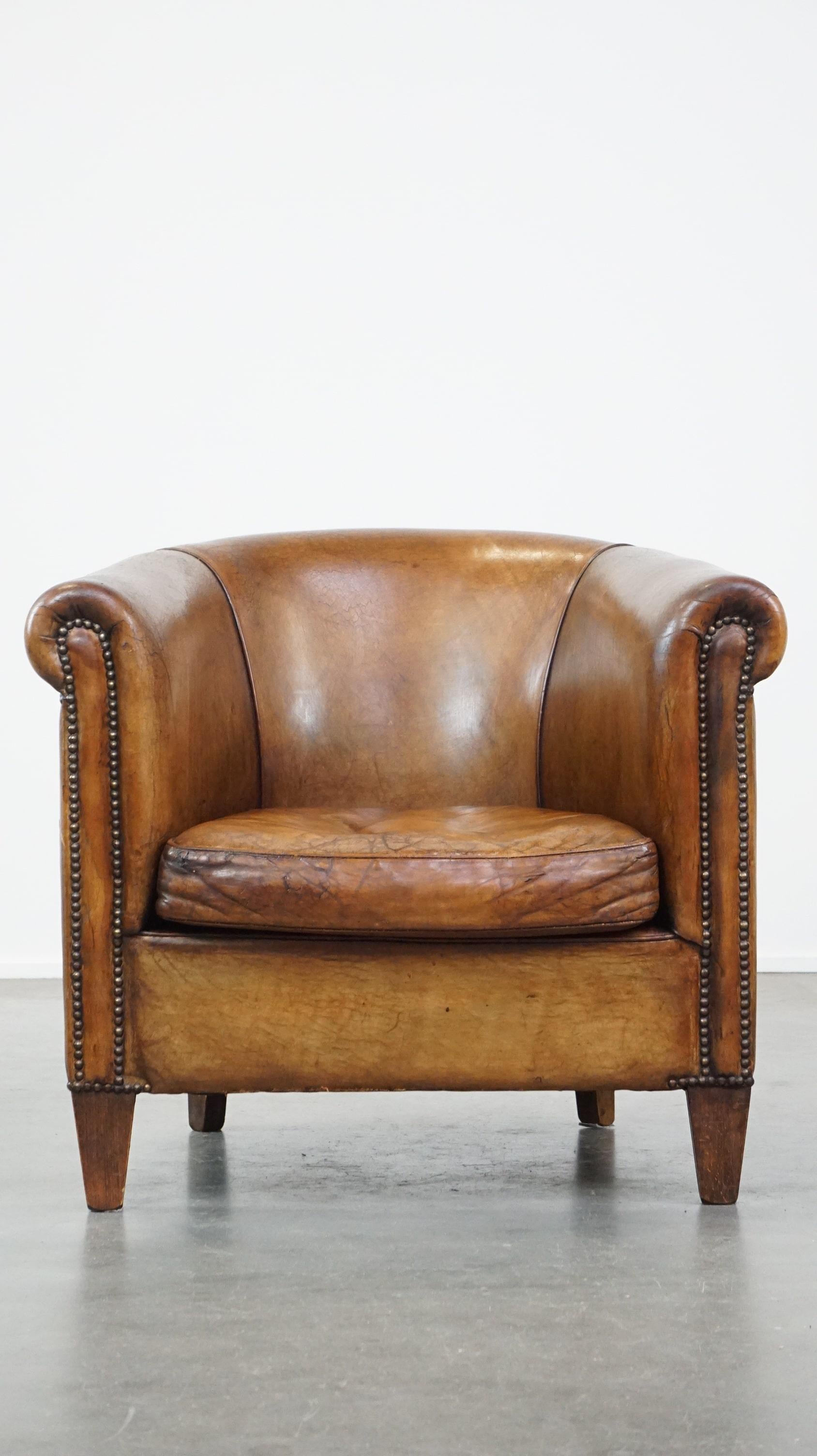 This beautiful timeless armchair has acquired a lovely luxurious vintage look through years of responsible use. The colors are stunning and warm, and the patina is unparalleled.
Due to years of use, it has some signs of wear, as is visible in the