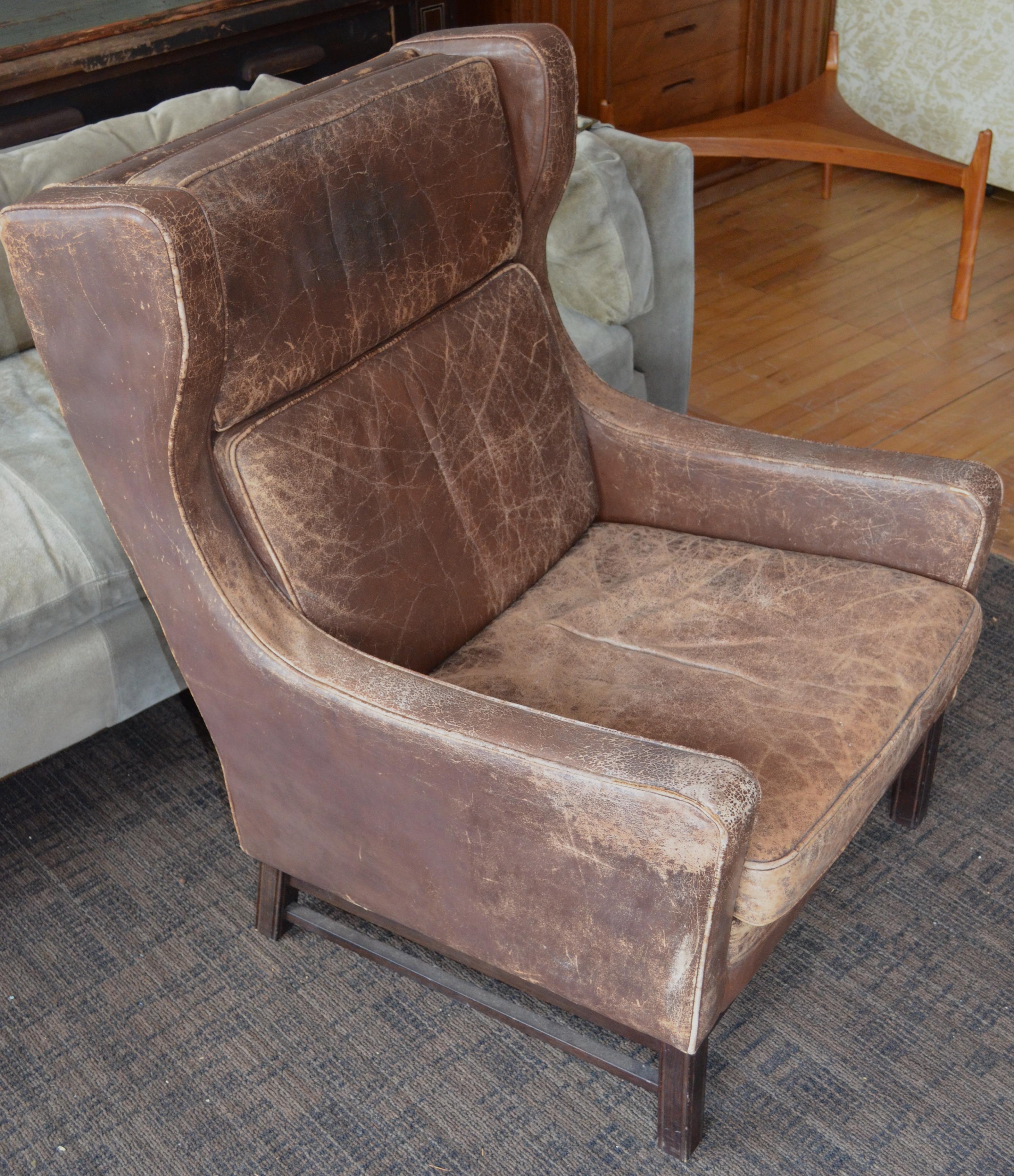 Club Chair of Worn Leather from Edwardian England, Wingback, Early 20th Century For Sale 1