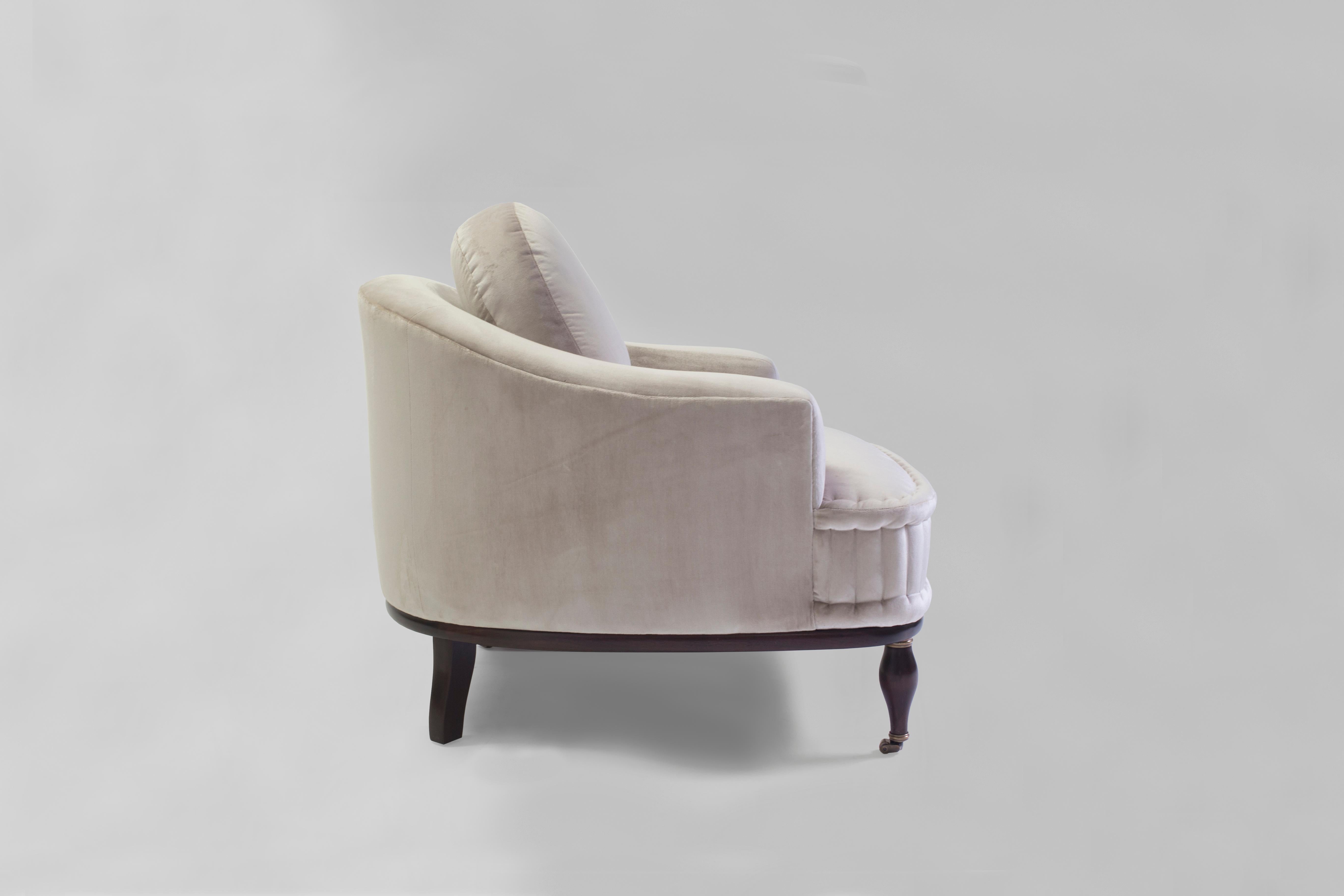 The Gladys club chair is a deco Classic beauty with loose back cushion made of feather and down and square back and arms with clean seams - it has a solid seat with hand-stitched rolled mattress edges as done in the old school upholstery technique -