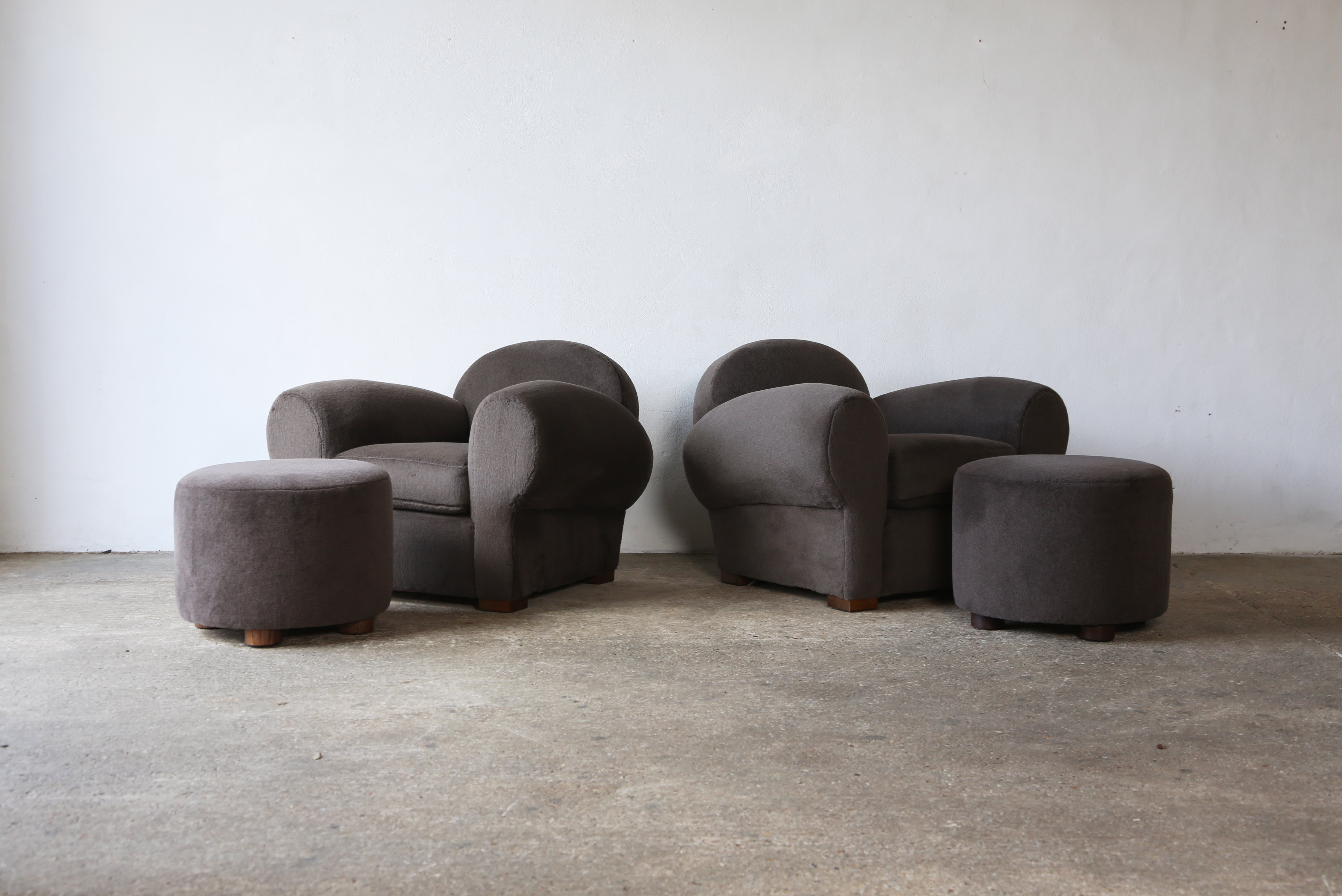 Superb modern club chair and ottoman, upholstered in pure Alpaca. High quality hand-made beech frame and newly upholstered in a brown/grey premium 100% alpaca fabric.  This listing is for one chair and ottoman.   For a pair please see our other