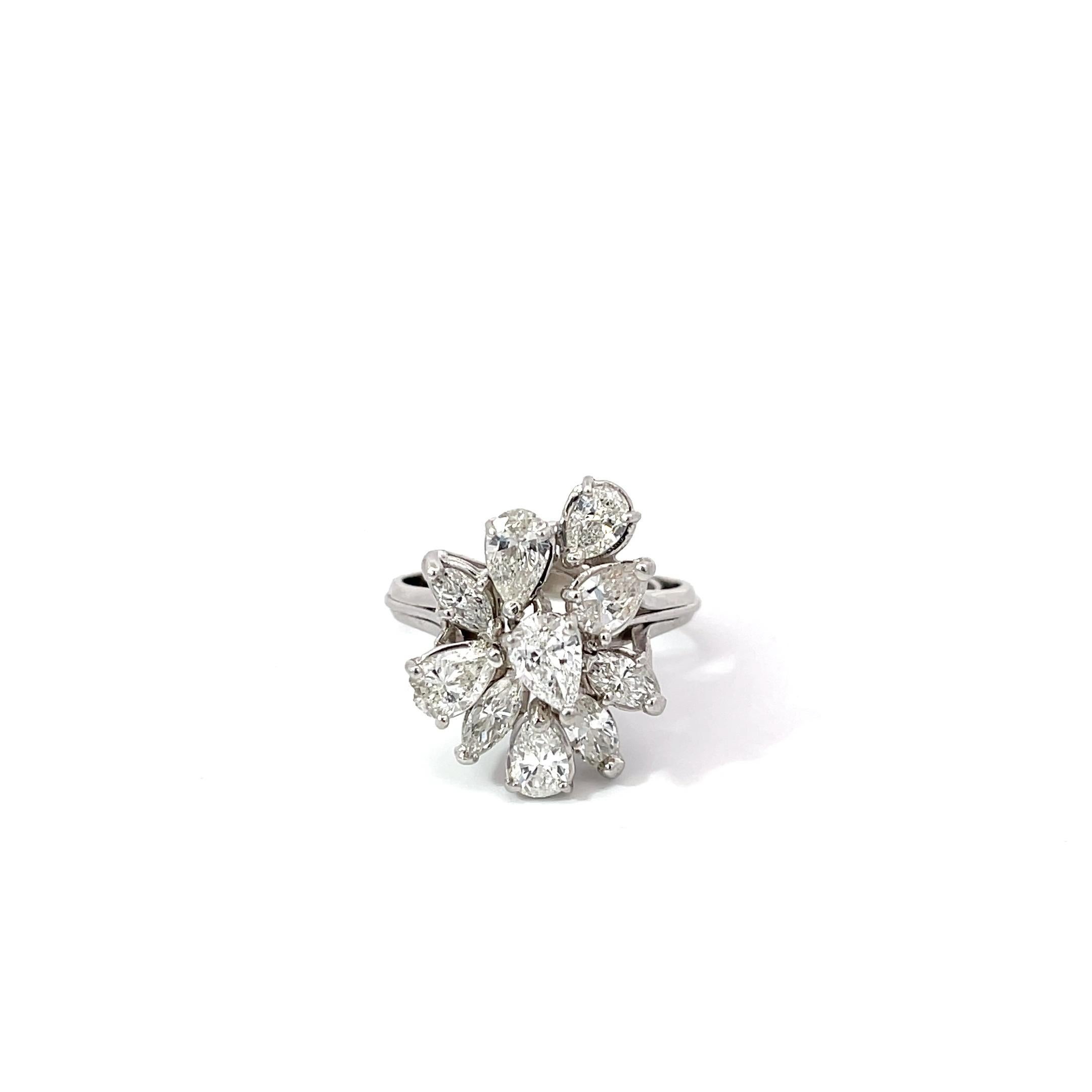 Cluster Diamond Ring in Platinum. The ring features 2.50ctw of pear and marquise cut diamonds. Ring size 9