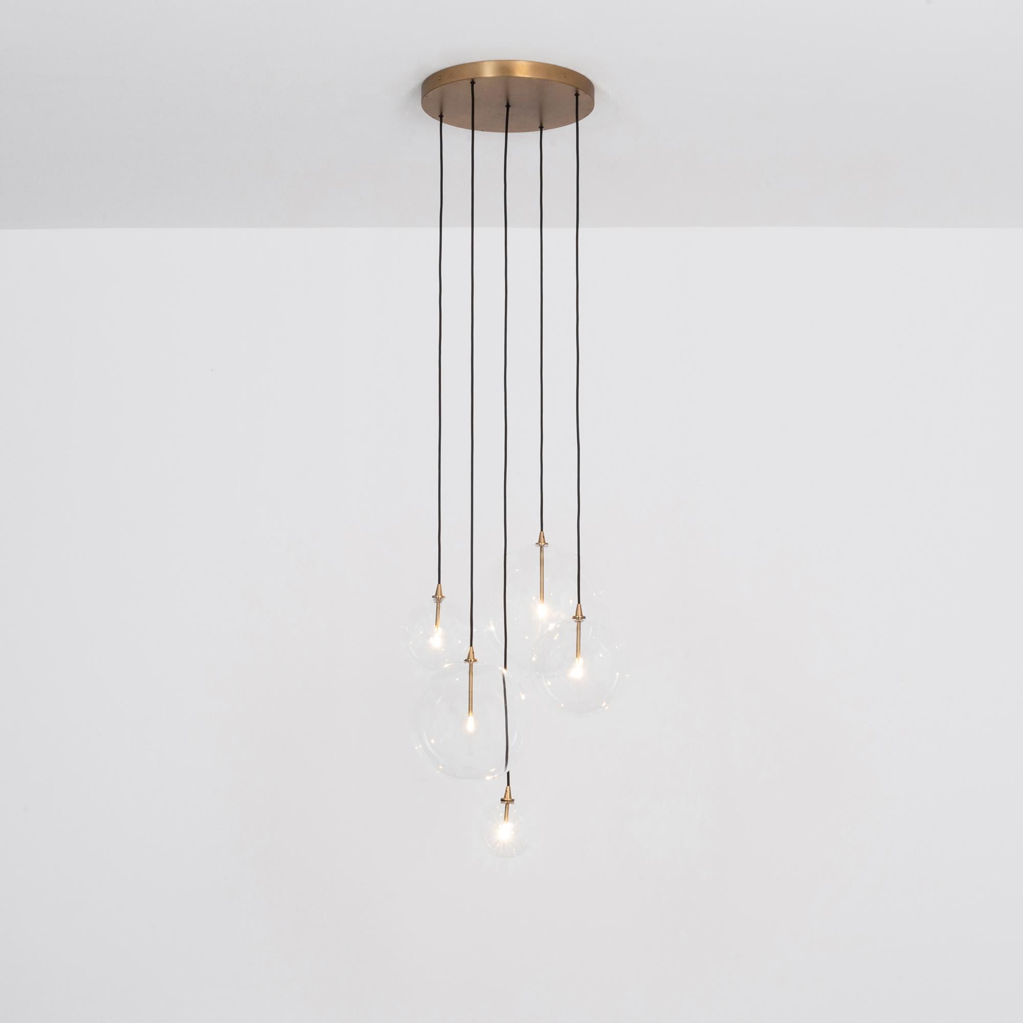 Cluster 5 Mix Chandelier in Solid Brass by Schwung
Dimensions: W 62 x D 72 x H 315 cm
Materials: Natural brass, hand blown glass globes

Ceiling plate diameter 45cm / H 4.5 cm
Glass globes diameter 35 / 30 / 25 / 20 / 15 cm
Max qty of bulbs
