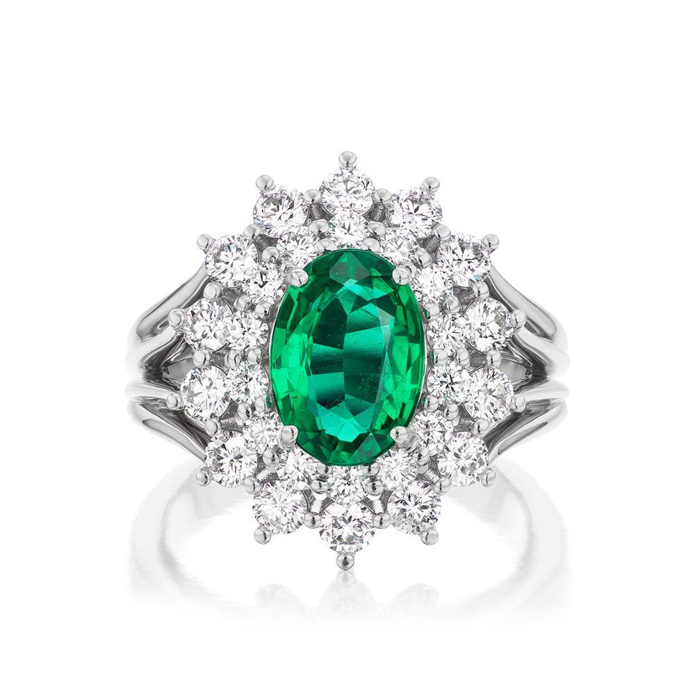 CLUSTER DIAMOND
AND EMERALD RING
A classic piece from Takat, a beautiful Oval shaped 1.71 ct Emerald
surrounded by an intricate and fascinating pattern of polished diamonds.
Item: # 04131
Metal: 18k White Gold
Color Weight: 1.71 ct.
Diamond Weight: