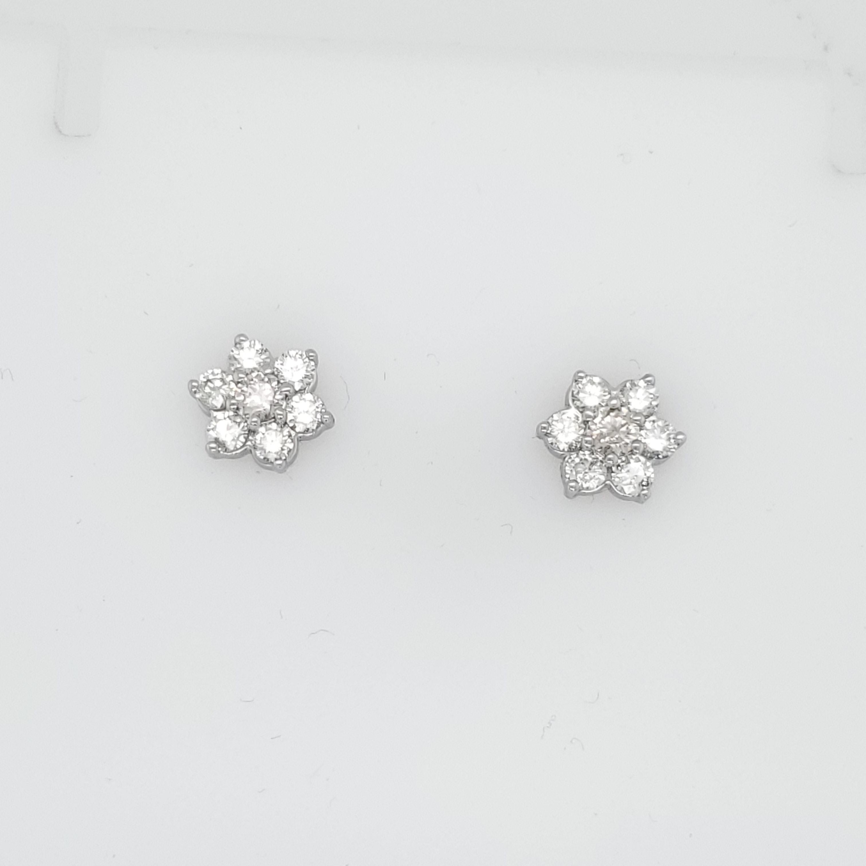 Cluster Flower Diamond Earrings with approximately 1.63 carats of white diamonds. We estimate G colors and SI clarity. All set in 14k white gold. 