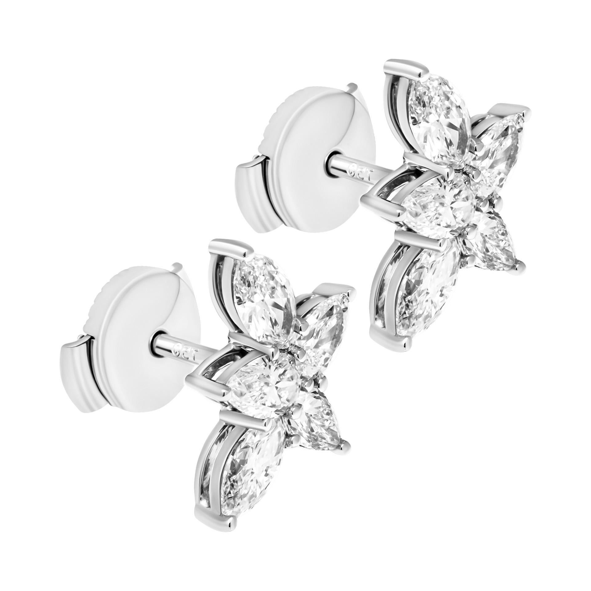 Cluster Earrings in 18K White Gold
with mixed shaped diamonds
4st marquee totaling 0.58ct F/G color VS clarity
6st pear shapes totaling 0.61ct F/G color VS clarity

Pressure Back lock system 
