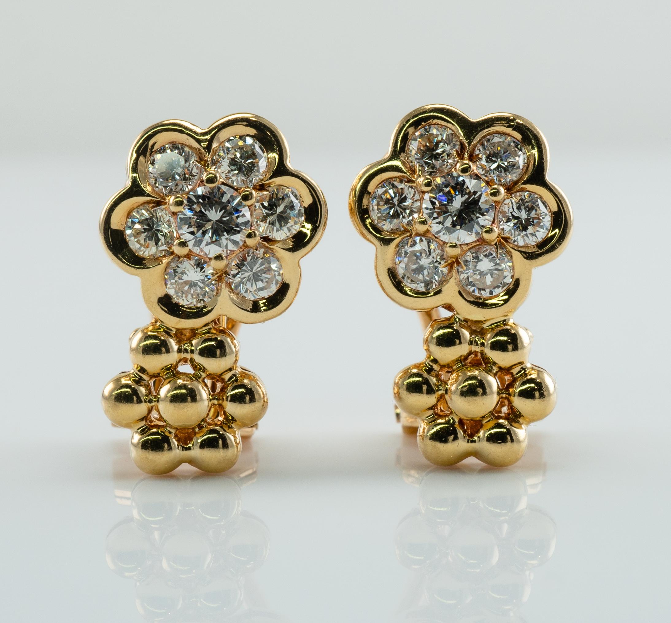 Cluster Diamond Flower Earrings 18K Gold 1.32 TDW Convertible Pierced and Clips

These gorgeous estate earrings are finely crafted in solid 18K Yellow gold.
Each earring is set with 7 Genuine Diamonds of VVS2 clarity and G color! 
The grand total