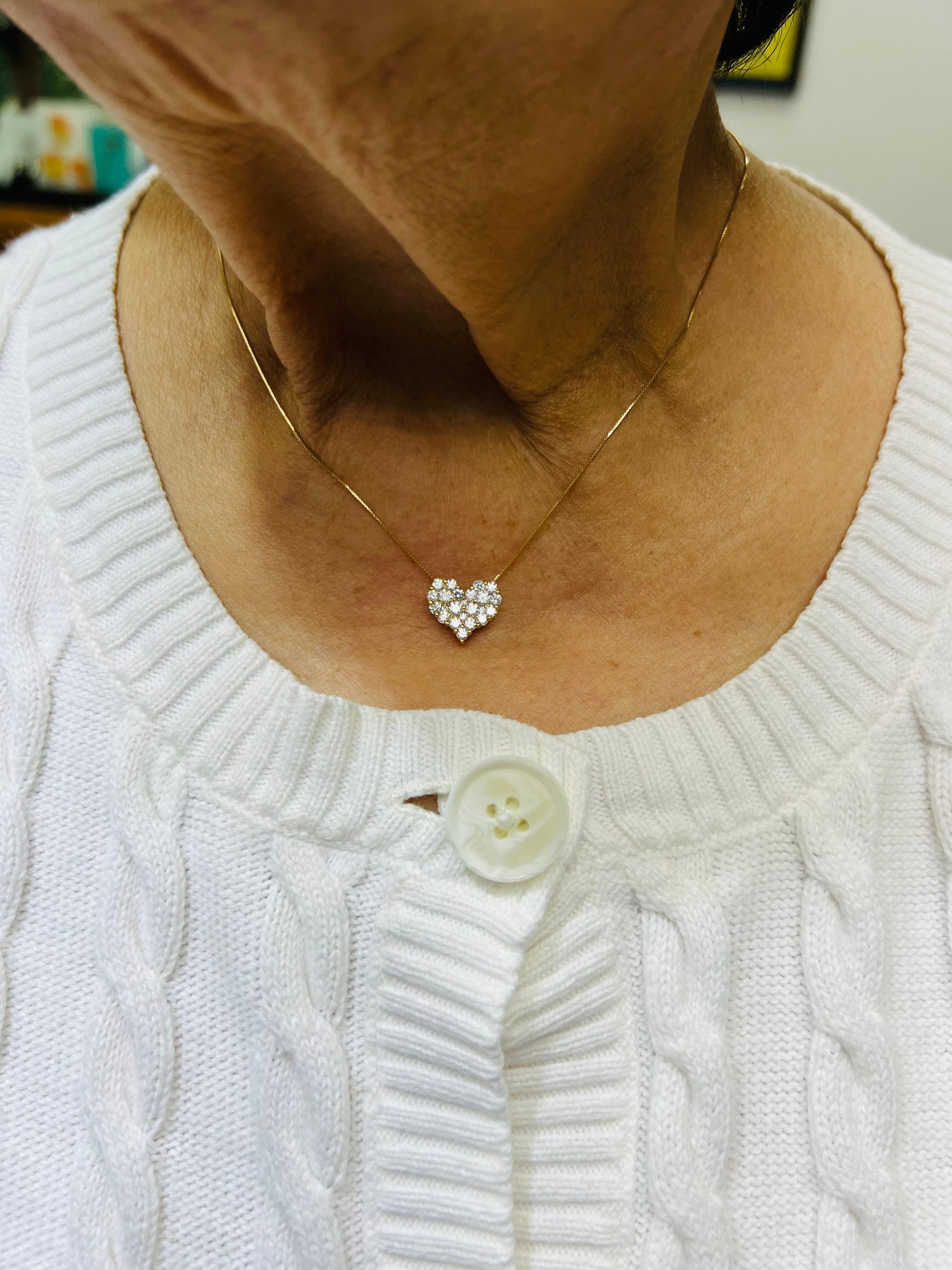 Cluster Diamond Heart Pendant Necklace 18k yellow gold.

The Cluster Diamond Heart Pendant is made in 18k yellow gold and is suspended from a 17.75
