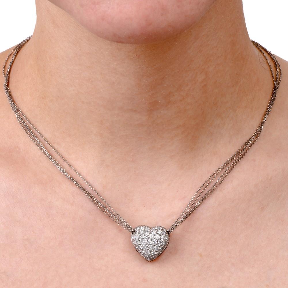 This diamond heart necklace is crafted in solid platinum. Features a diamond cluster heart pendant of approx. 2.80 carats, F-G color, VS1 clarity pave-set. Pendant displays an open work back and necklace is made up of 4 layered strands of platinum