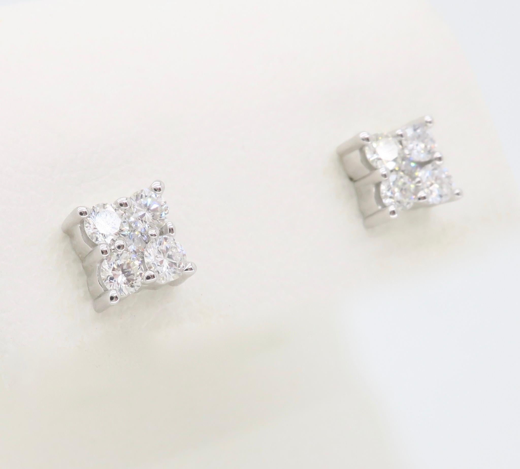 Cluster diamond stud earrings made in 14k white gold.

Total Diamond Carat Weight:  Approximately .55CTW
Diamond Cut: Round Brilliant Cut 
Color: F-H
Clarity: VS-SI 
Metal: 14K White Gold
Marked/Tested: Tested 14K, backs stamped “14k