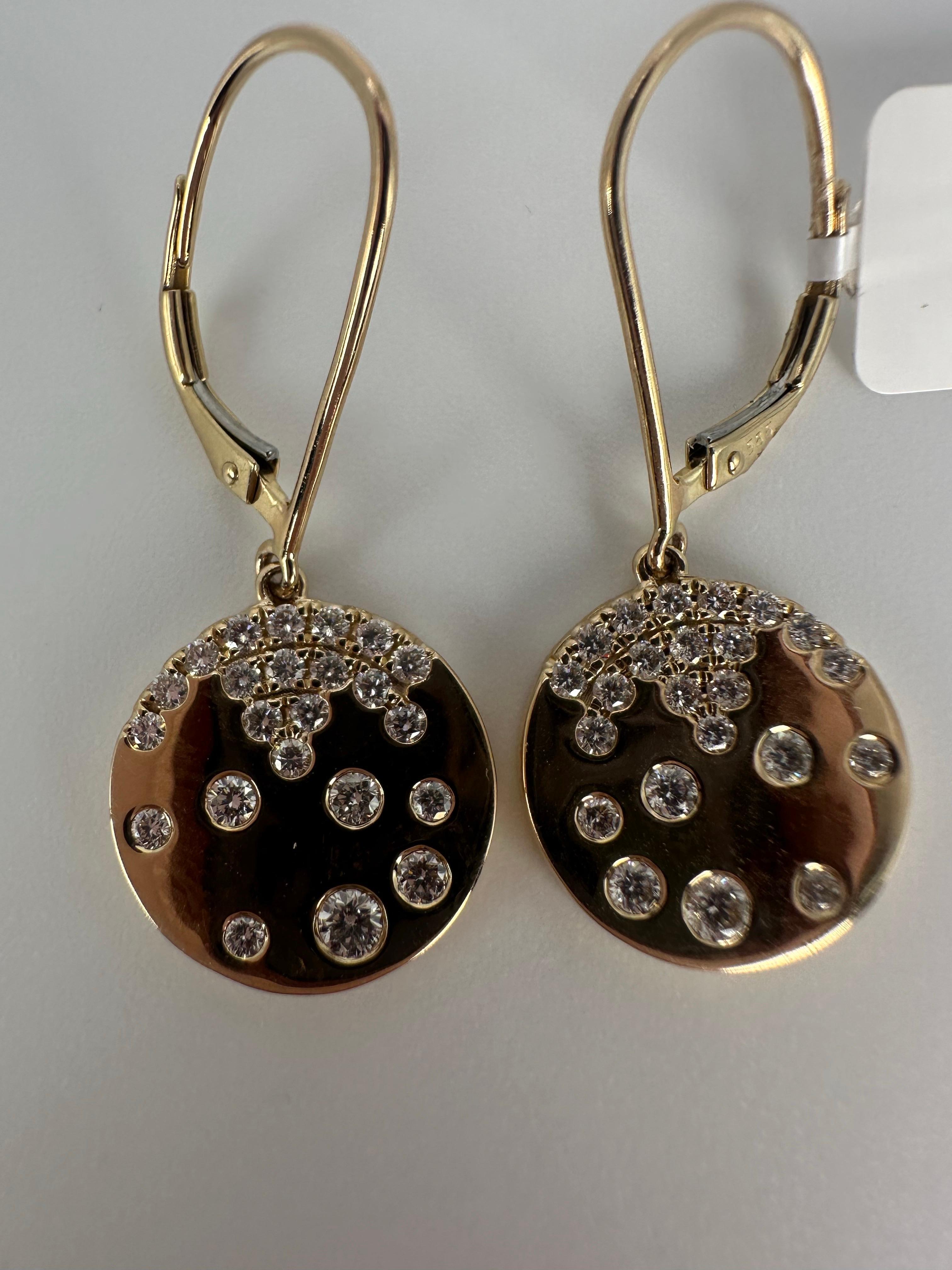 Cluster earrings totaling 0.66 carats of natural diamonds with F-G color and VS clarity, so elegant and so modern on ears! Made in 14KT gold in comfortable lever back closure!

Comes with beautiful packaging, certificate of authenticity and fast