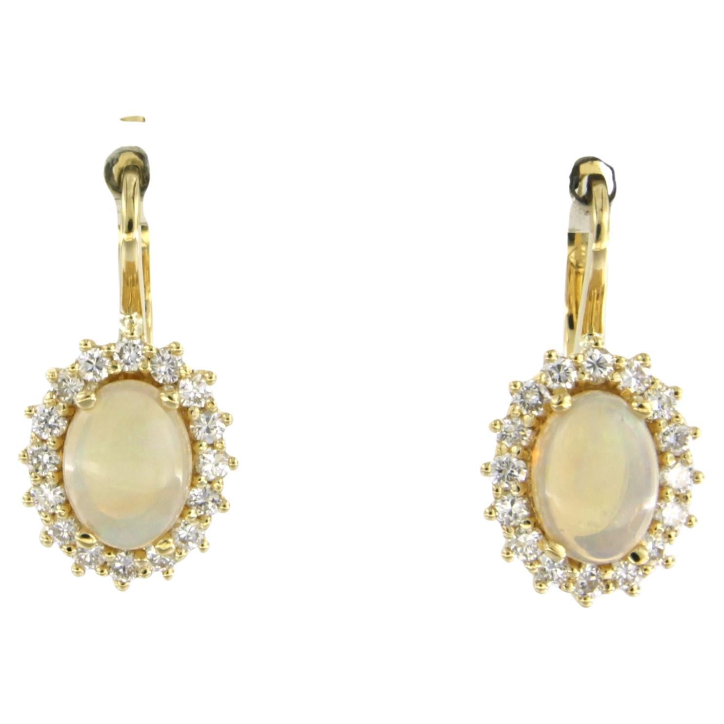 Cluster earrings set with opal and diamonds 18k yellow gold