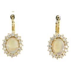 Cluster earrings set with opal and diamonds 18k yellow gold
