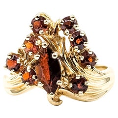 Anello con granato a grappolo in oro giallo 14k