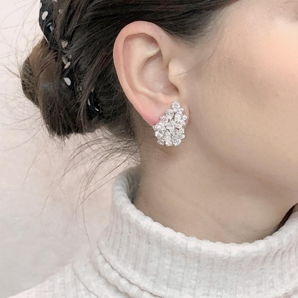 Elegant diamond platinum earrings with a cluster of brilliant pear cut diamonds 10.98 carat total. 
Diamonds are white and natural and in G-H Color Clarity VS.
Platinum 950 metal.
French  Omega clips.
Contemporary elegant style at it's best.
Length: