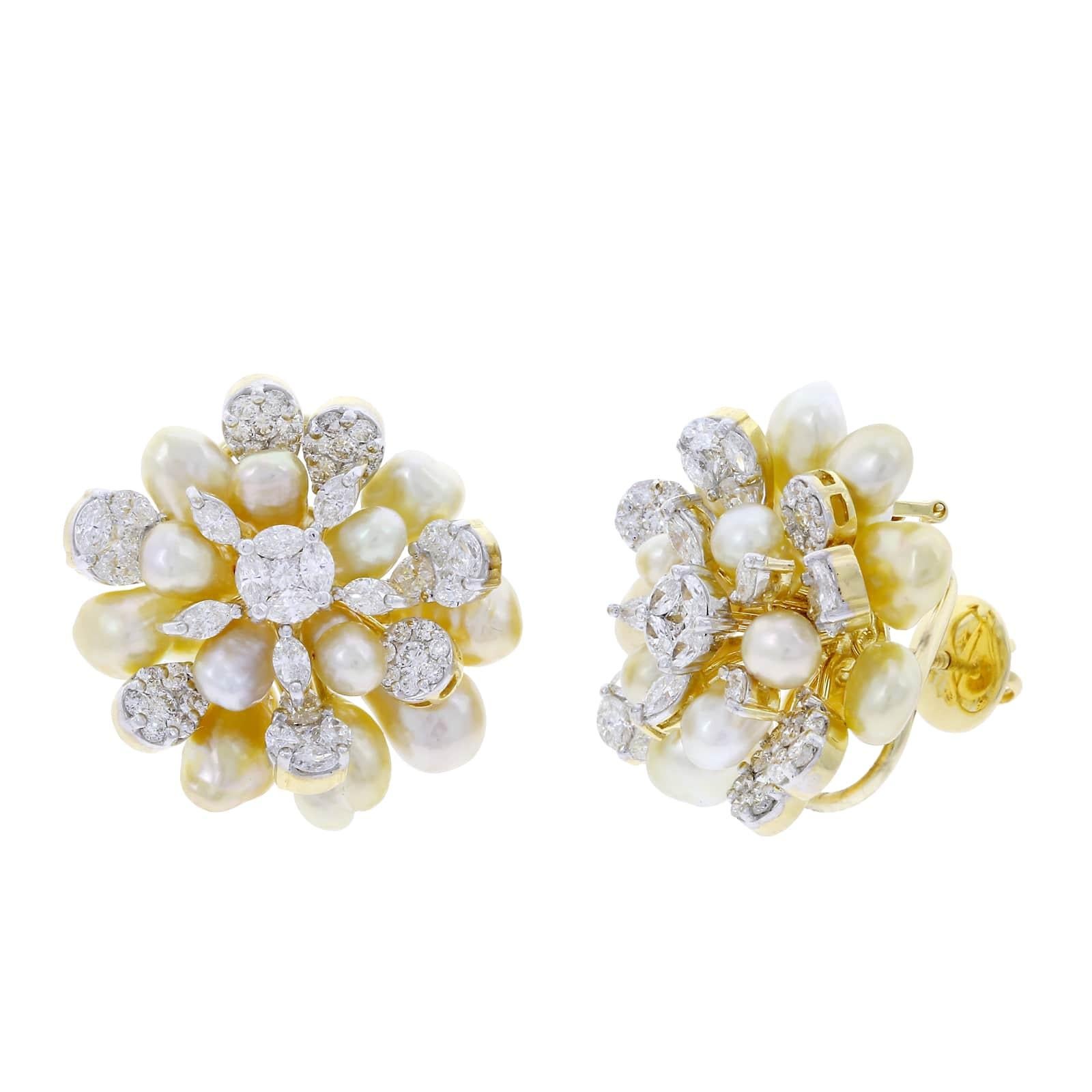 A stunning and elegant pair of cluster earrings accented with pearls and diamonds. Total Diamond Weight: Pear (0.85 cts). Princess (0.85 cts.), Marquise (2.71 cts.) H Color, VS Clarity. The pearls weigh approzimately 38 carats. 18K Yellow Gold. Part