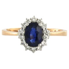Cluster ring set with center stone sapphire and diamonds 18k bicolour gold Cluster ring set with center stone sapphire and diamonds 18k bicolour gold