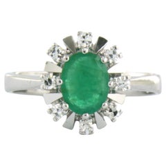 Cluster ring set with emerald and diamonds up to 0.16ct 14k white gold