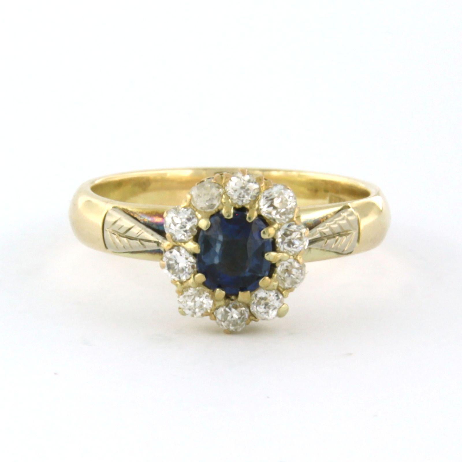 14k yellow gold cluster ring set with a central sapphire of approximately 0.60ct and arround of old mine cut diamonds up to . 0.30ct - F/G - VS/SI/P - ring size U.S. 7 - EU. 17.25(54)

detailed description:

the top of the ring is 1.0 cm wide

Ring