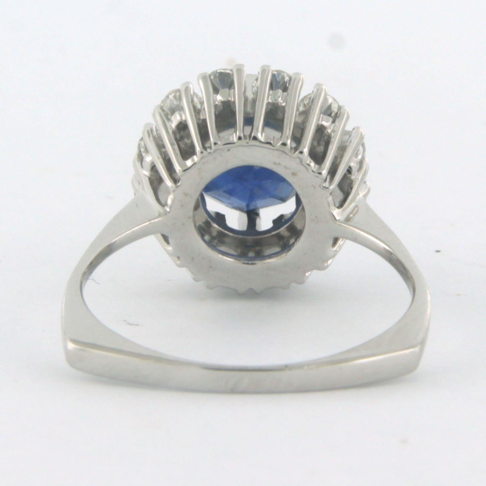 Women's Cluster ring with center stone Sapphire and arround diamonds 18k white gold For Sale