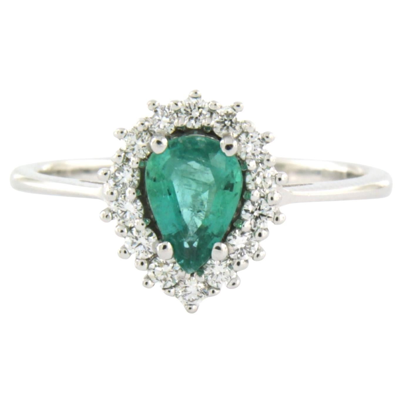 Cluster ring with emerald and brilliant cut diamond up to 0.24ct 18k white gold