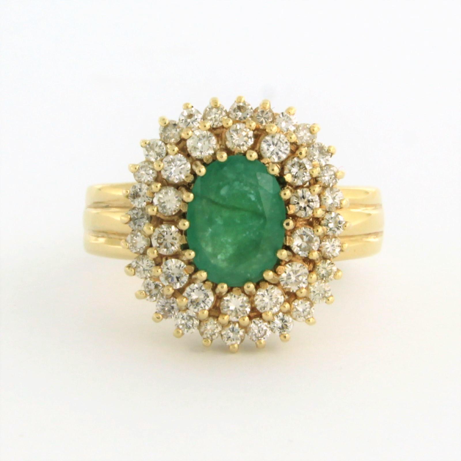 14k yellow entourage ring set with emerald. 1.10ct and an entourage of brilliant cut diamonds up to. 1.00ct – G/H – VS/SI – ring size U.S. 8.75 - EU. 18.75(59)

detailed description:

The top of the ring is in an oval shape of 1.7 cm by 1.5 cm wide