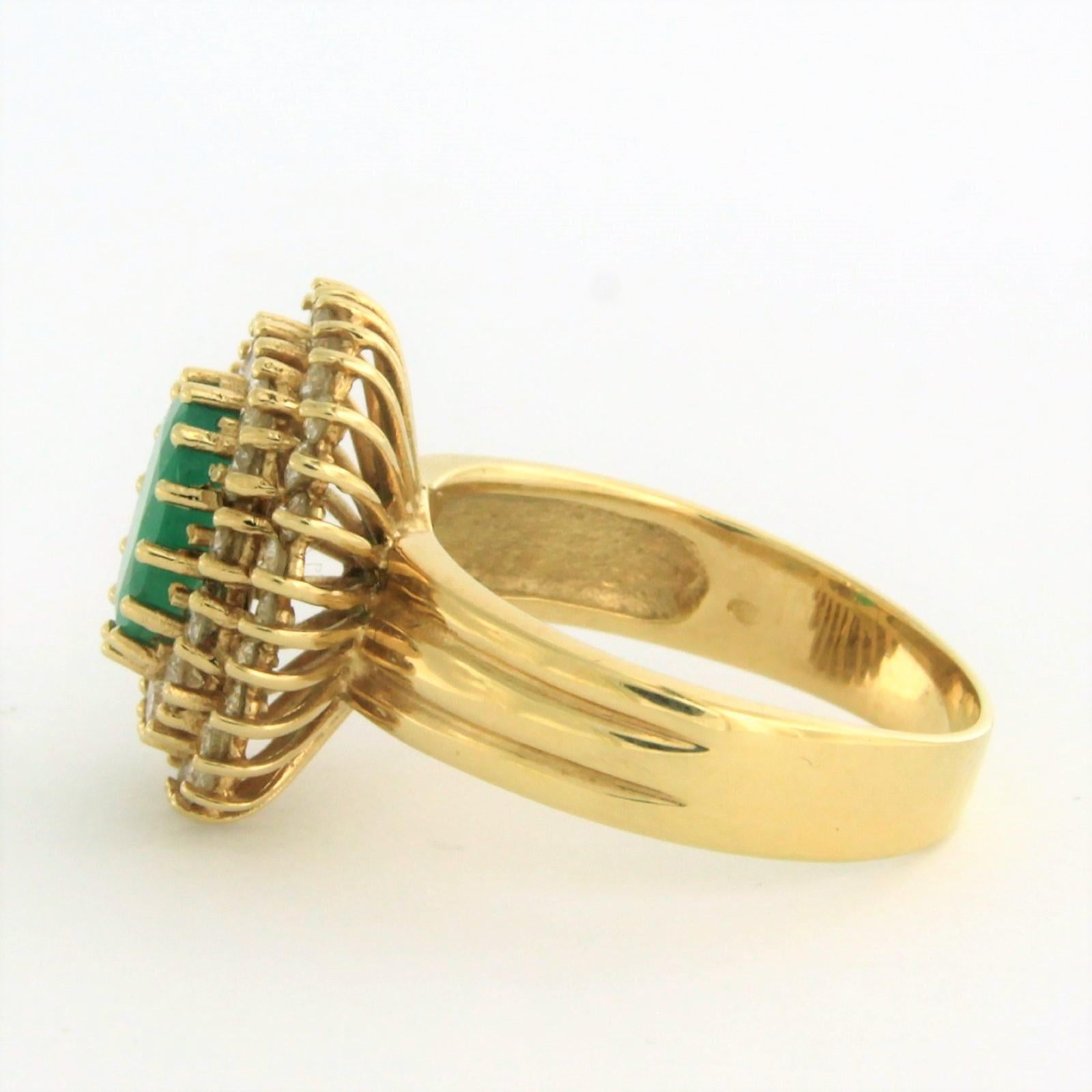 Oval Cut Cluster Ring with emerald and diamonds 14k yellow gold For Sale