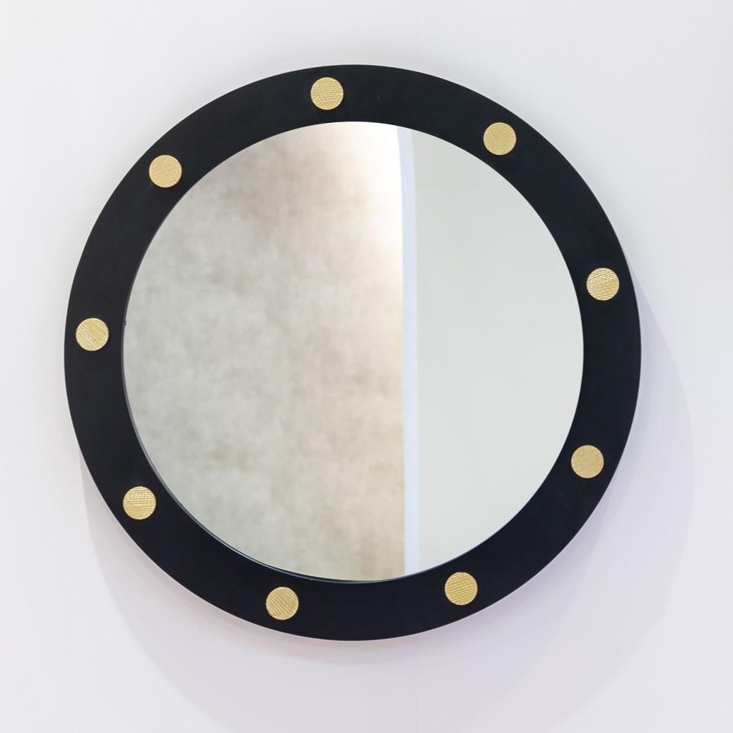 Cluster Round 62 Mirror by DUISTT 
Dimensions: W 62 x D 4 x H 62 cm
Materials: Black Iron Structure with Brushed Brass Details

Cluster round mirror features a mate black lacquered iron structure with carved brass details. Becoming a fundamental