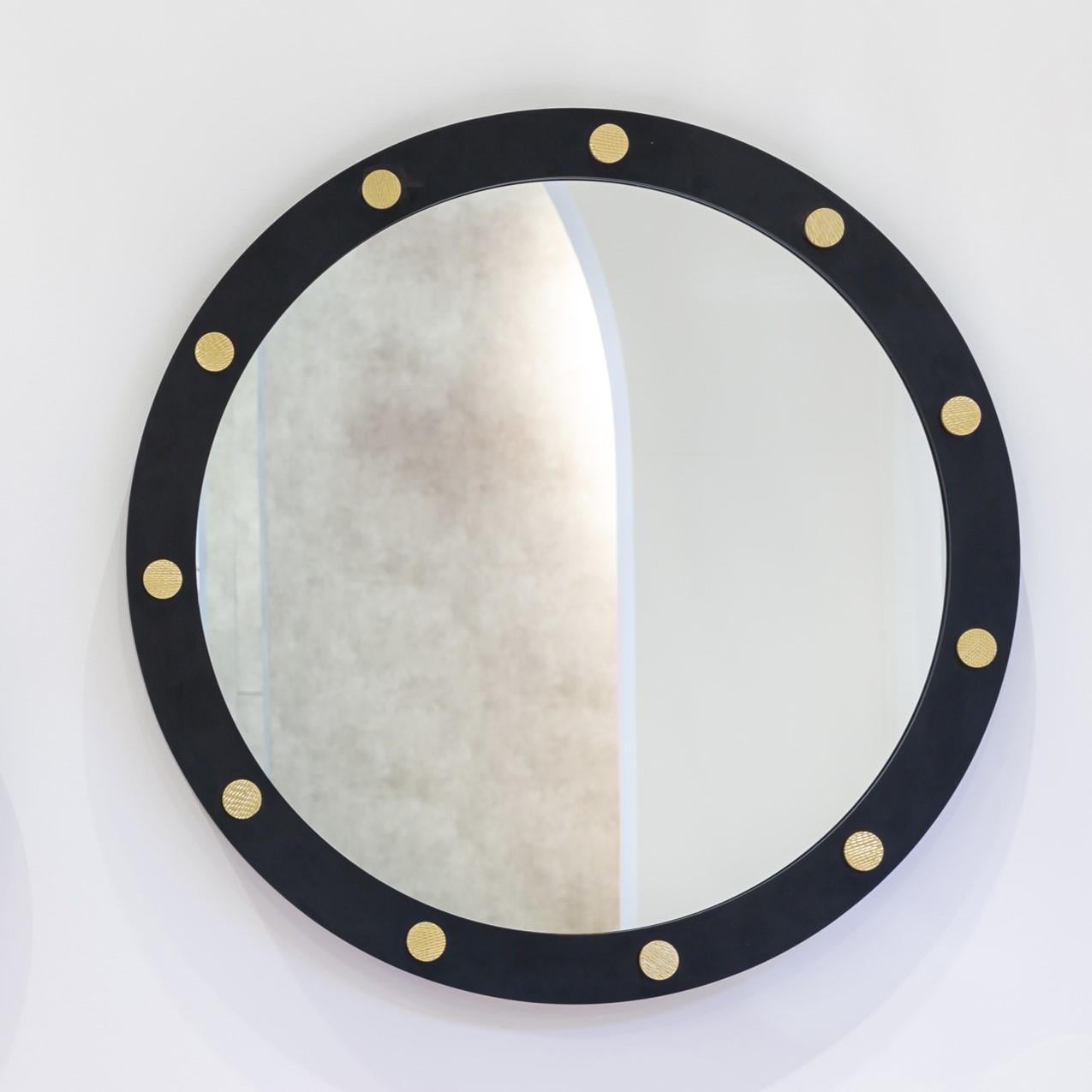 Cluster Round 80 Mirror by DUISTT 
Dimensions: W 80 x D 4 x H 80 cm
Materials: Black Iron Structure with Brushed Brass Details

Cluster round mirror features a mate black lacquered iron structure with carved brass details. Becoming a fundamental