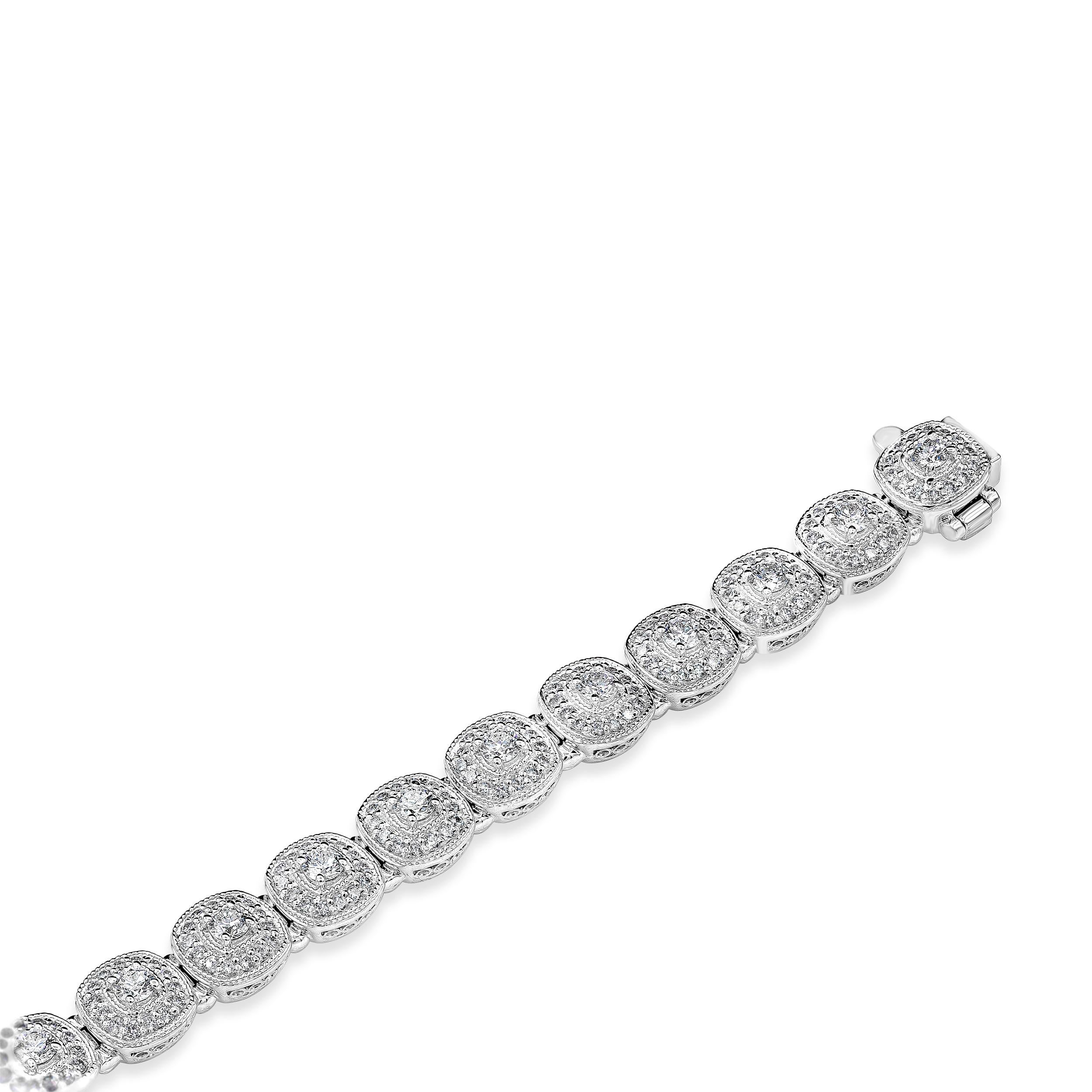 An illusion tennis bracelet showcasing a cushion cut diamond weighing 1.55 carats total, surrounded with round brilliant diamonds weighing 1.51 carats total, F in Color and VS-SI in Clarity. Cluster illusion in a cushion style setting tennis
