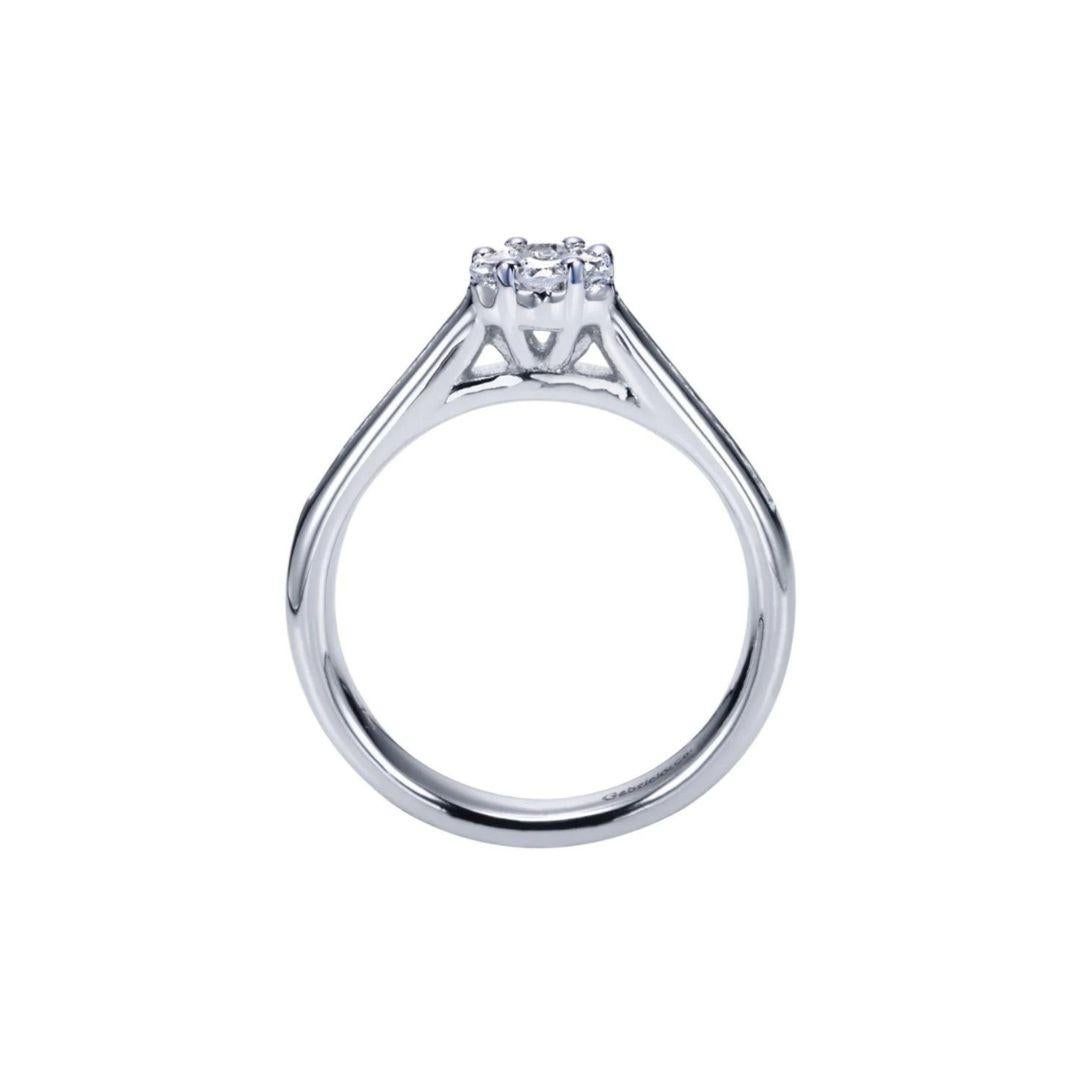 Ladies' Cluster 14k White Gold Diamond Engagement Ring. Classic channel set sides lead up to a beautiful cluster florette of gorgeous round diamonds for a delicate, romantic and feminine look. Total carat weight of diamonds 0.55 ctw, H color, SI