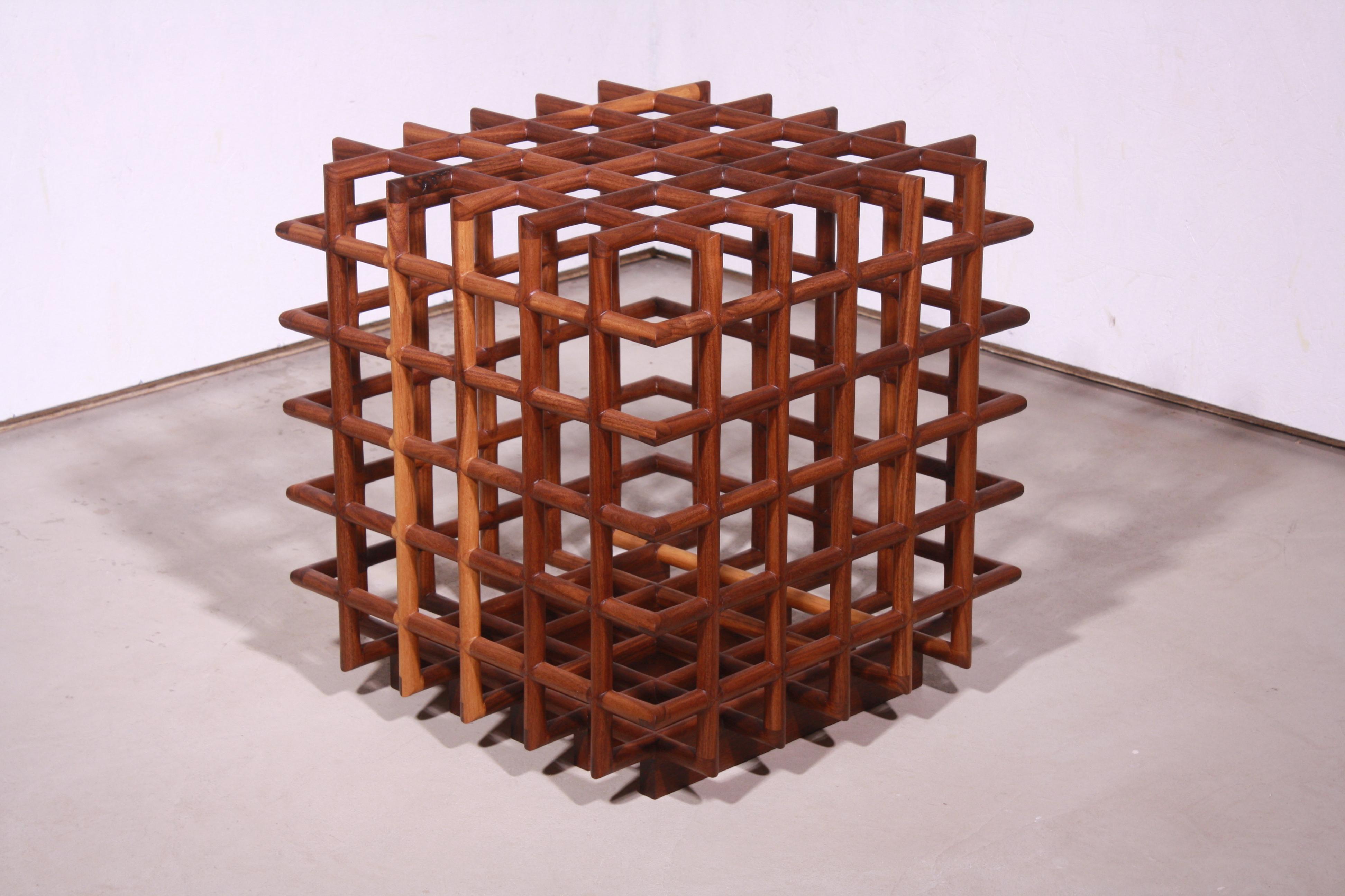 hand-carved, joined, sanded and oiled walnut lattice

approx. 1.5 cubic feet of volume

Perpetually unfinished, our wooden vessel is simultaneously closed and porous, able to clutch a few lemons but not contain them.  It is an object that questions