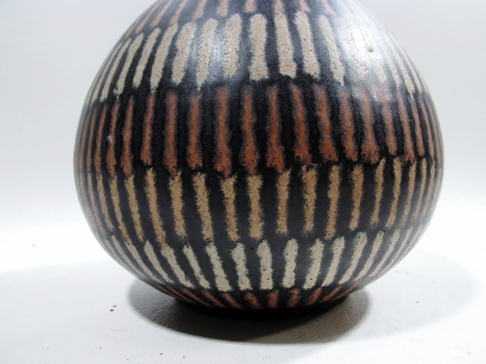 A bulbous form ceramic vase from renowned modernist Ohio potter Clyde Burt.