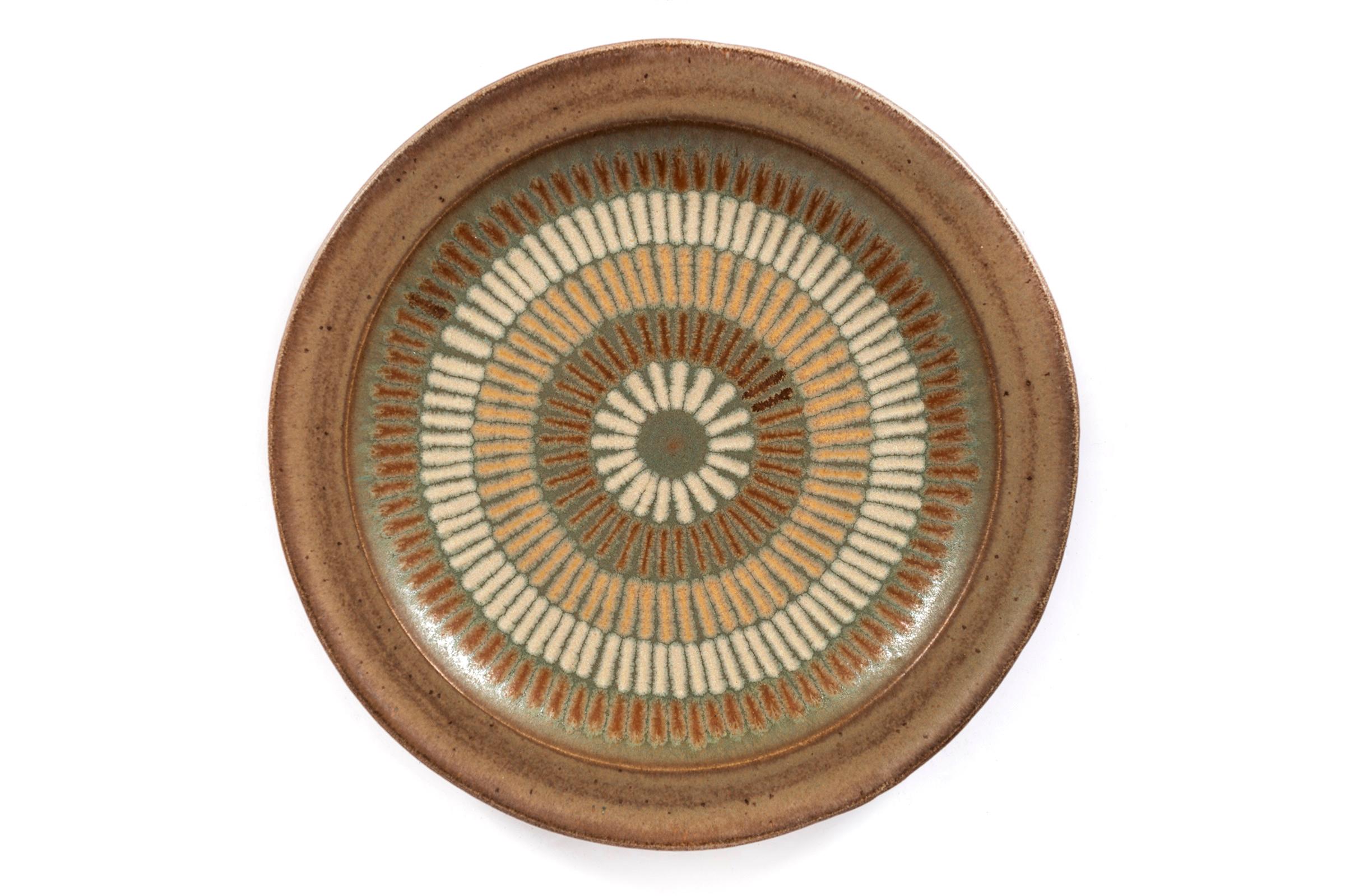 Clyde Burt ceramic platter glazed stoneware with incised, abstract details.
Signed to underside: [CB].
American, circa 1965.