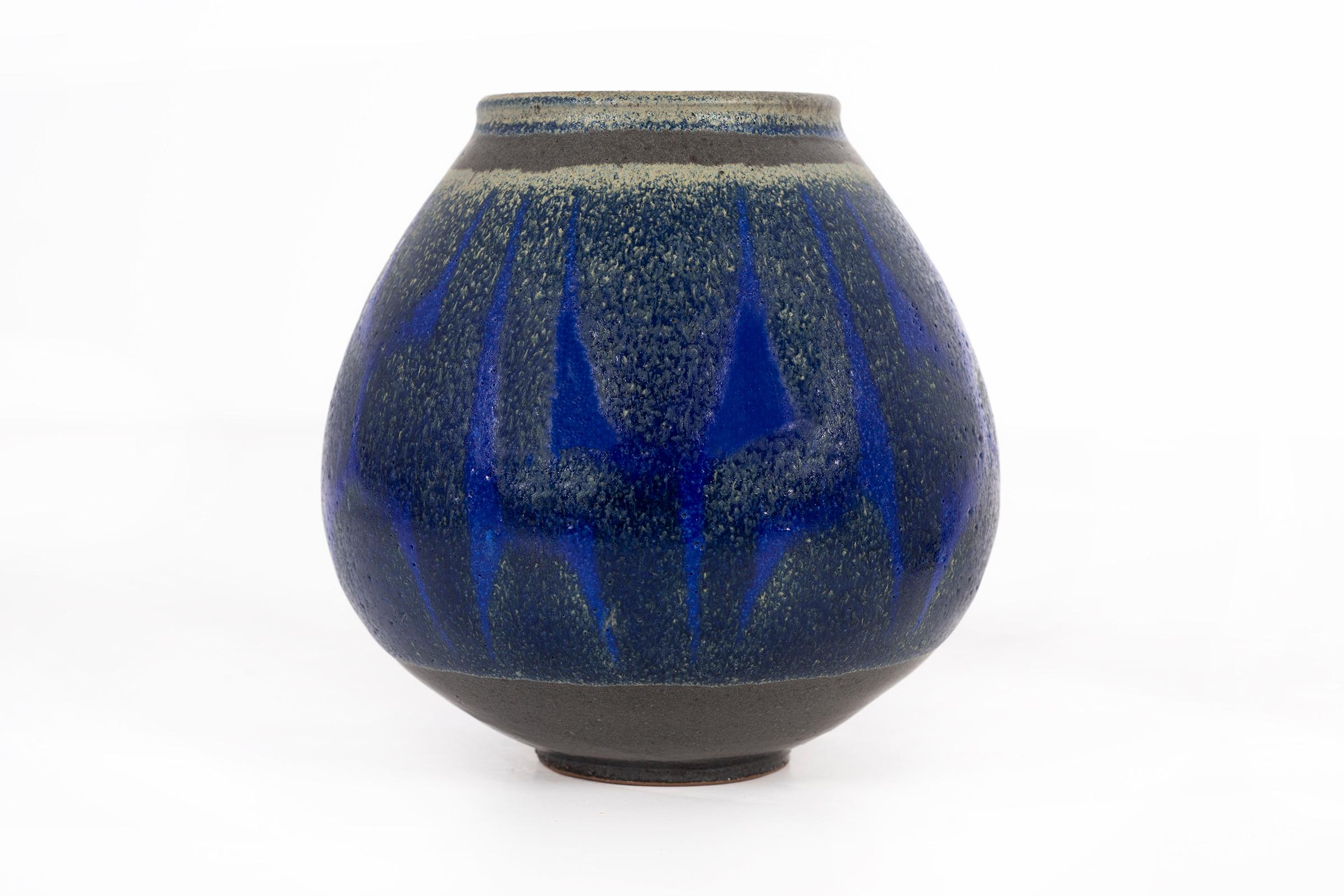 Clyde Burt ceramic vase in glazed stoneware with abstract multicolored glaze.
Signed to underside: [CB].
American, circa 1965.