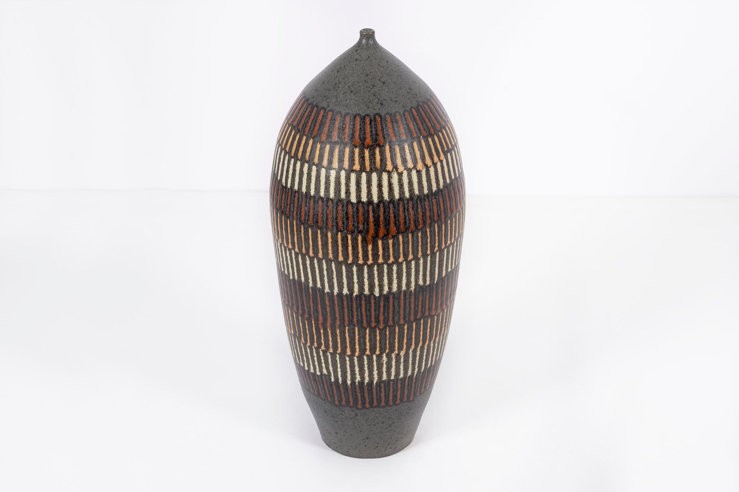 Clyde Burt ceramic vase in glazed stoneware multicolored glaze.
Signed to underside: [CB].
American, circa 1965.