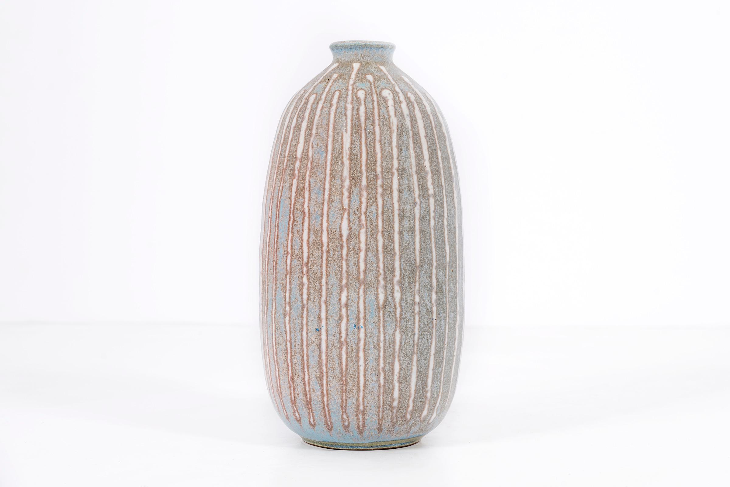Clyde Burt ceramic vase in glazed stoneware with incised, abstract details.
Signed to underside: [CB].
American, circa 1965.