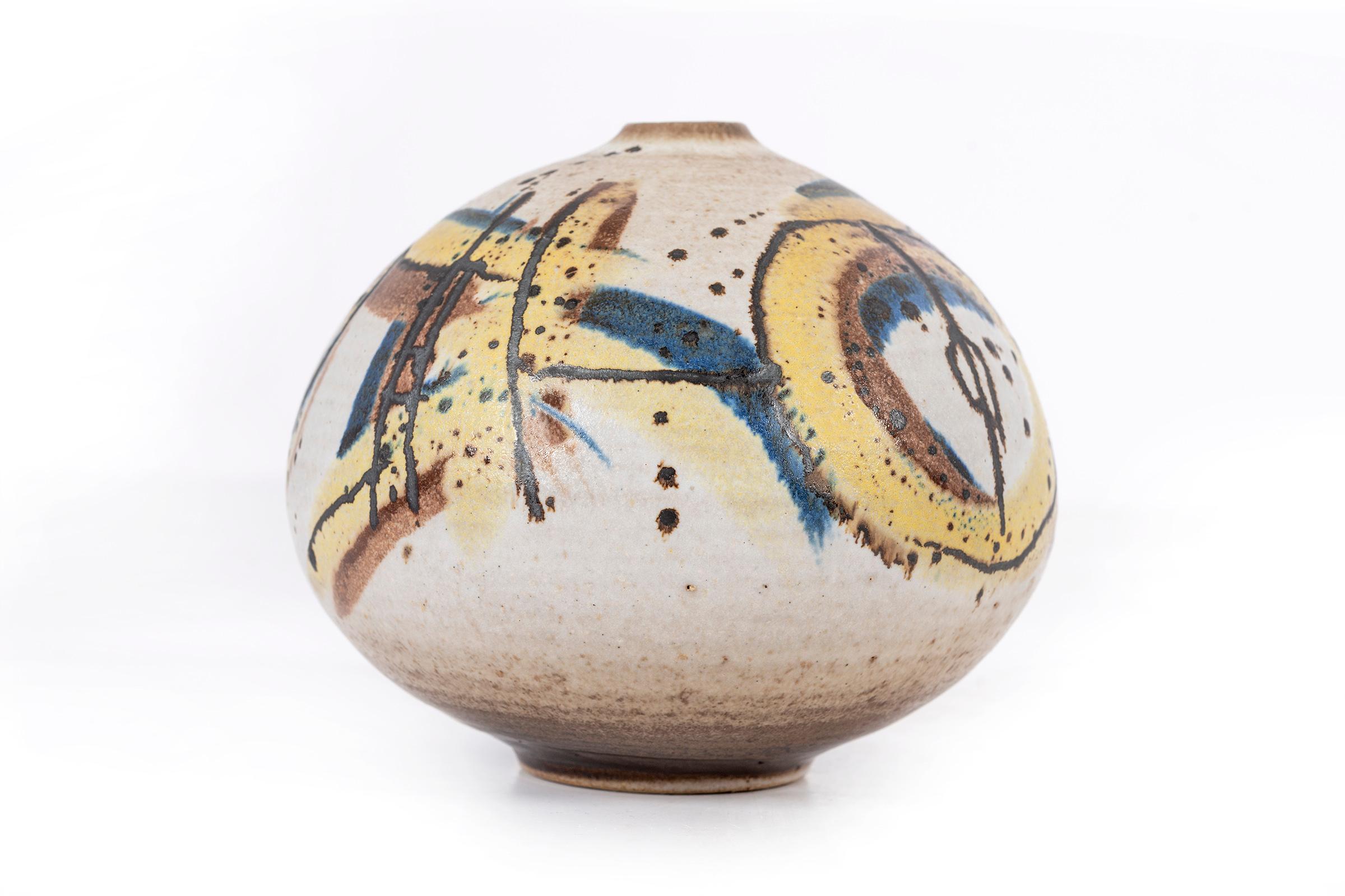 Clyde Burt ceramic vase in glazed stoneware with abstract multicolored glaze.
Signed to underside: [CB].
American, circa 1965.