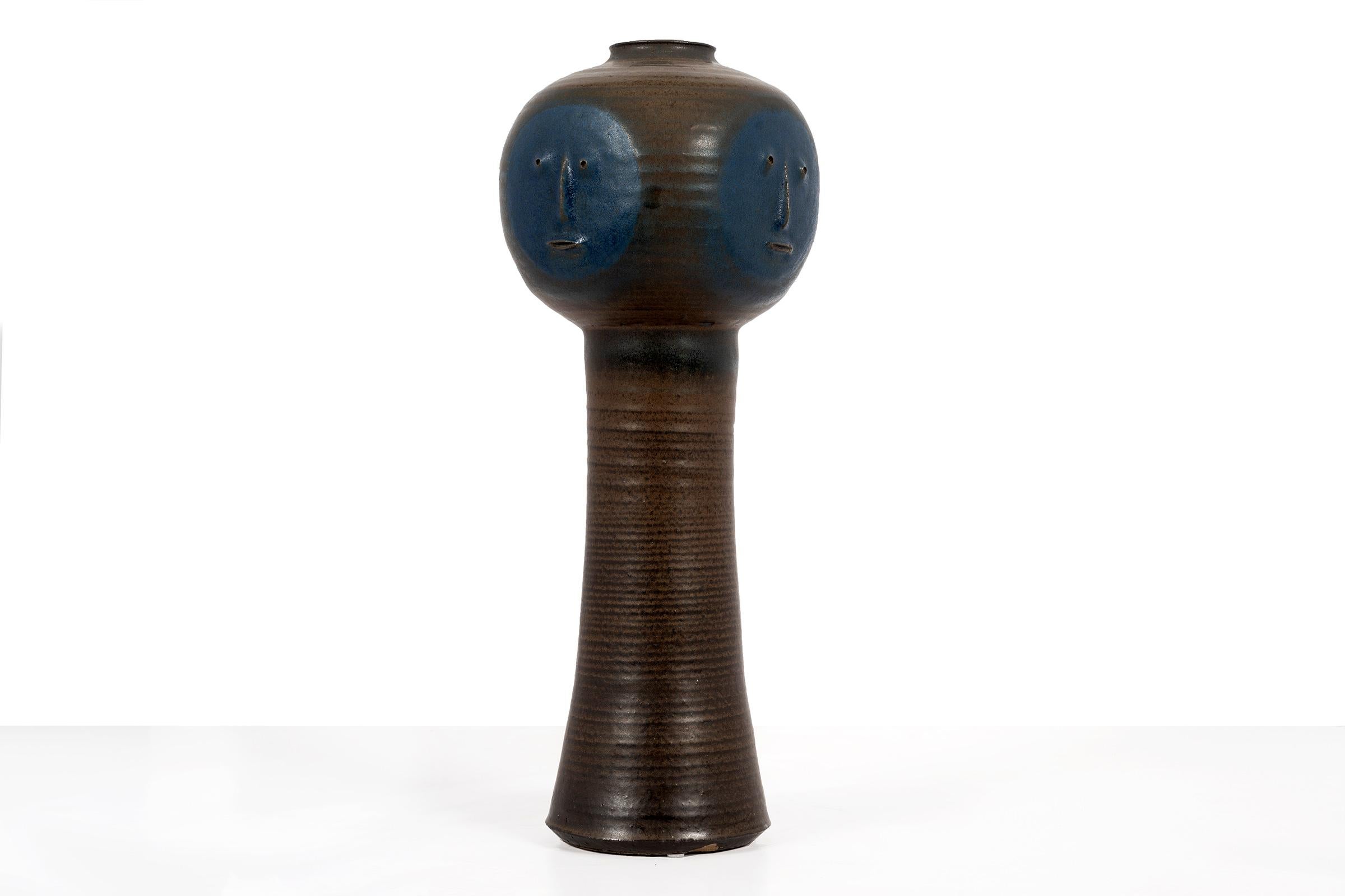 Clyde Burt stylized face vase in glazed stoneware with manipulated and applied facial details.
Signed to underside: [CB].
American, circa 1965.