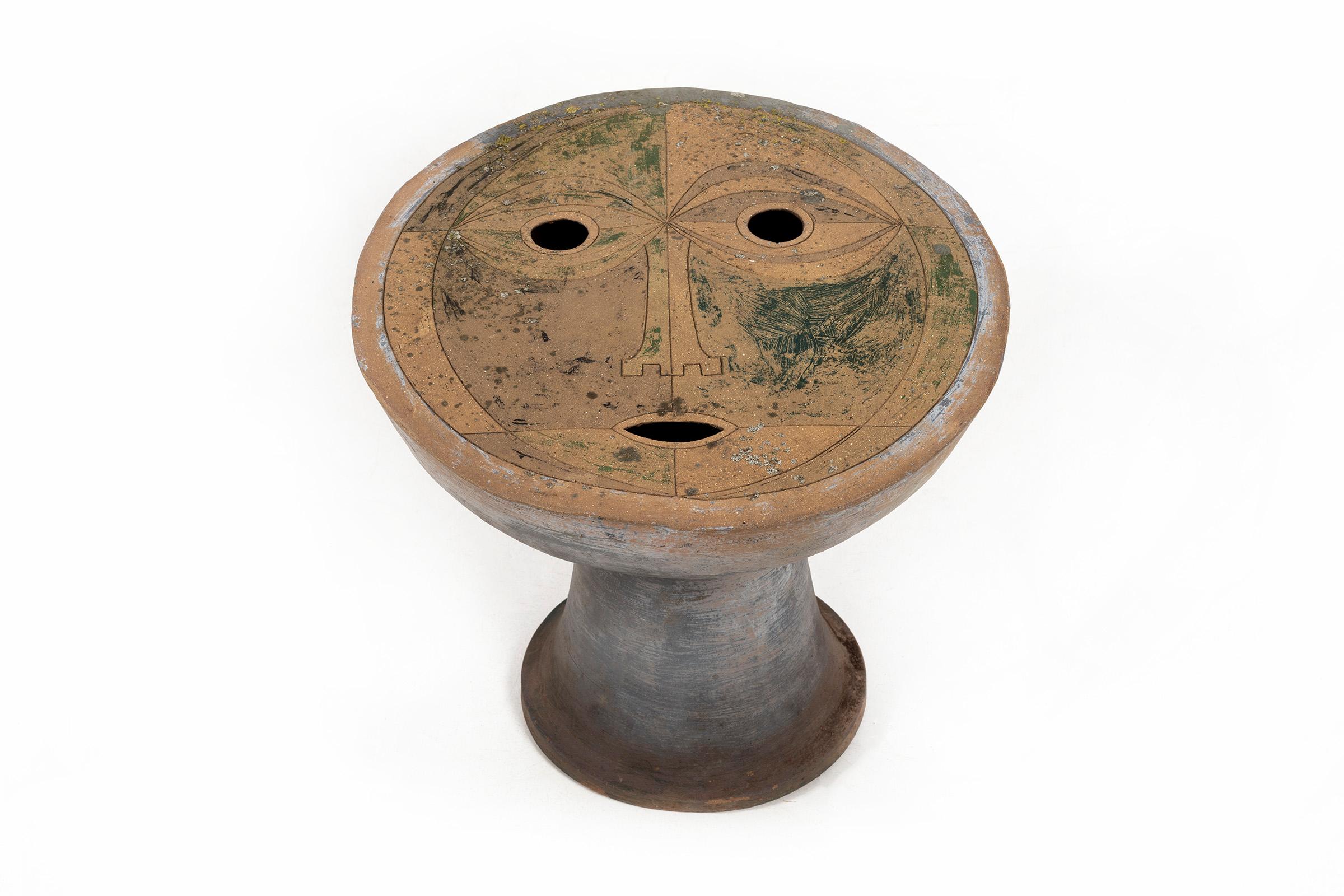 Clyde Burt Face Ceramic Table vase in glazed stoneware with incised facial carvings.
Signature to underside: [CB].
