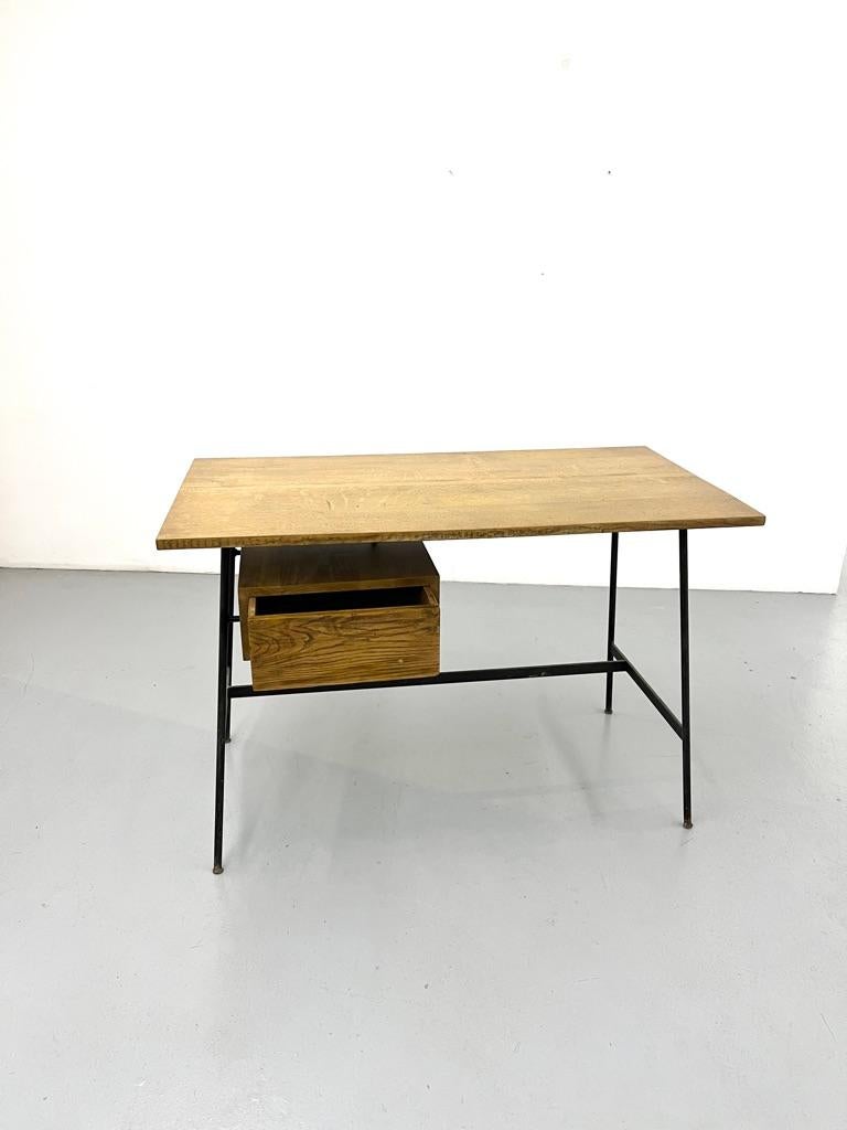CM 178 Desk in oak and metal by Pierre Paulin, Thonet, 1957

Born in 1927, Pierre Paulin enrolled at the end of the war at the Camondo school where his artistic and technical qualities were quickly noticed by his teacher Maxime Old who encouraged