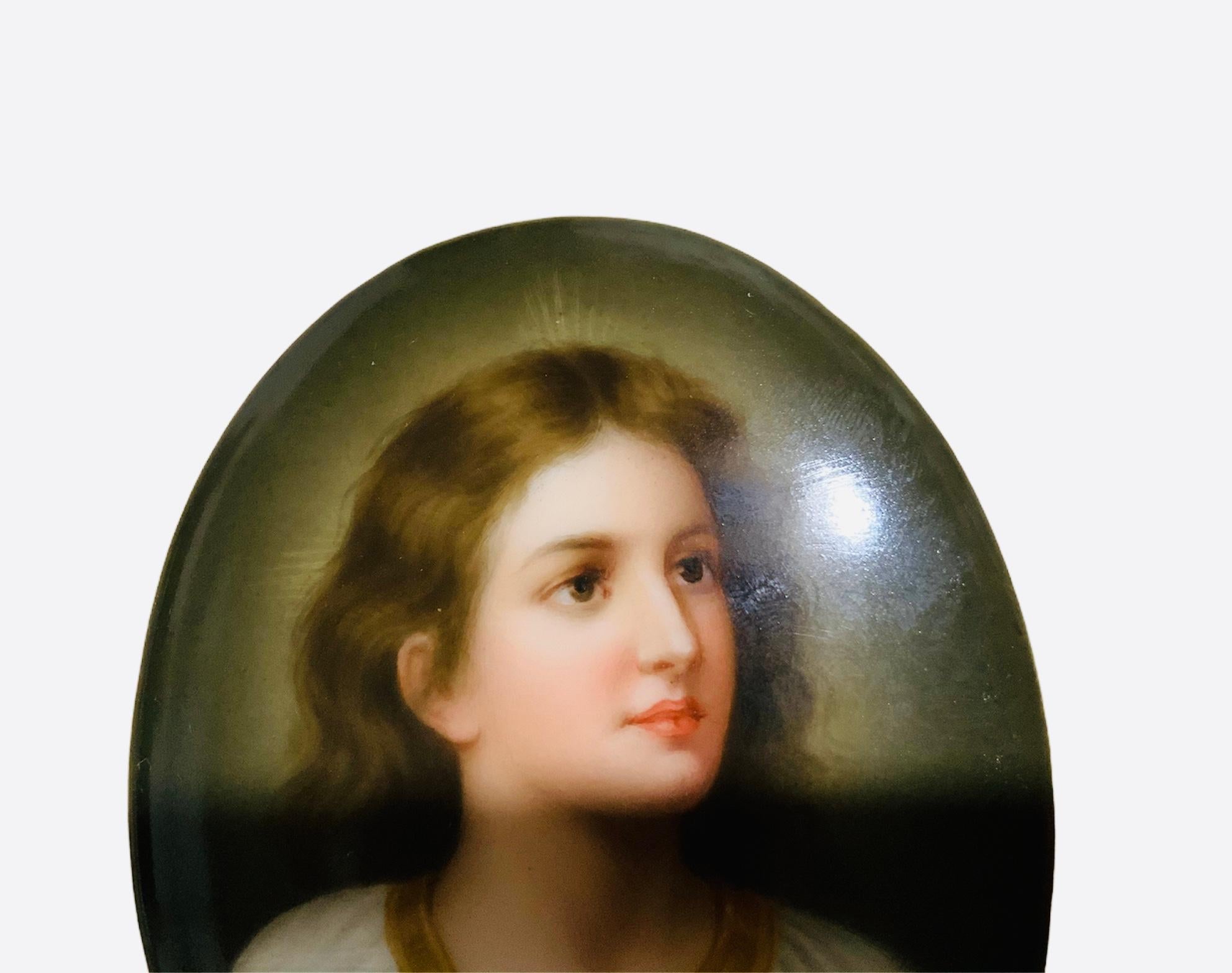 This is a C.M.Hutschenreuther hand painted porcelain small oval plaque. It depicts a portrait of a child Jesus after Heinrich Hoffman’s painting. His eyes depict a piercing and innocent gaze. It is signed Wagner in the left side. The