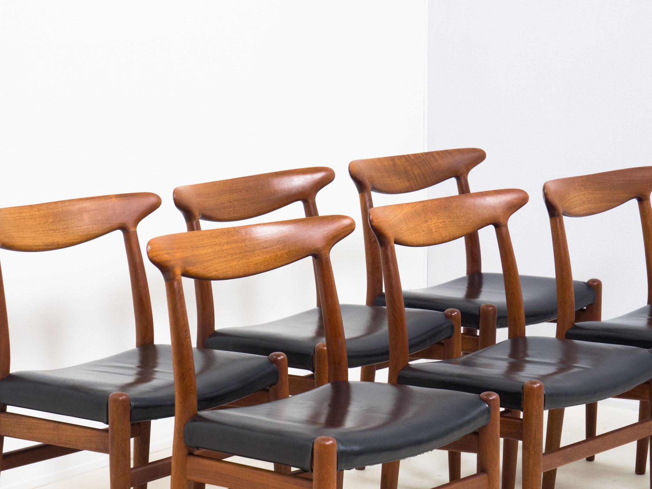 Iconic set of dining chairs designed by legendary designer Hans J. Wegner for C.M. Madsen of Denmark in the 1950s.

These chairs are made from solid teak and have their original black leather upholstery.

The set is in very good condition. The wood
