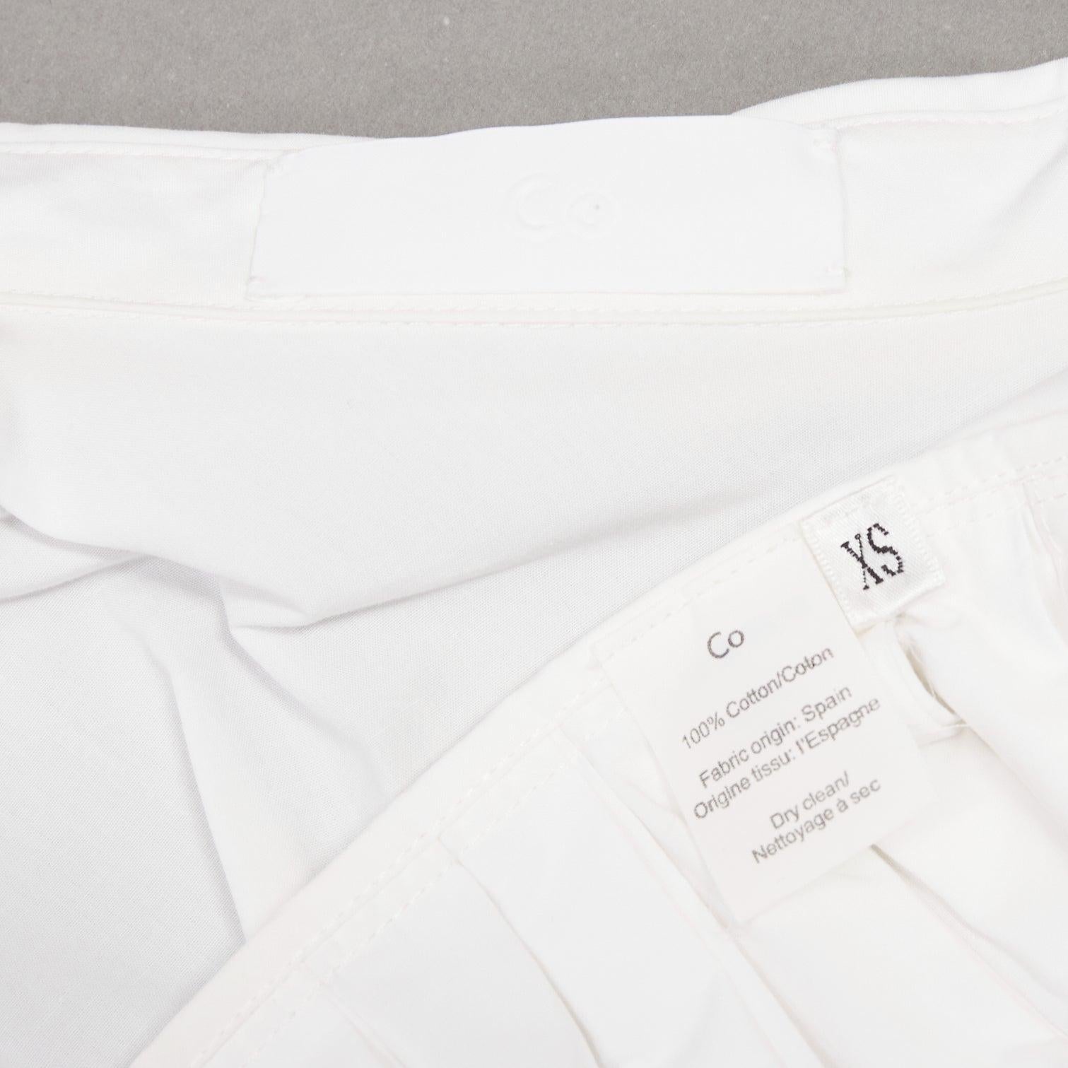 CO COLLECTIONS camicia in cotone bianco a vita alta con peplo plissettato US0 XS in vendita 3