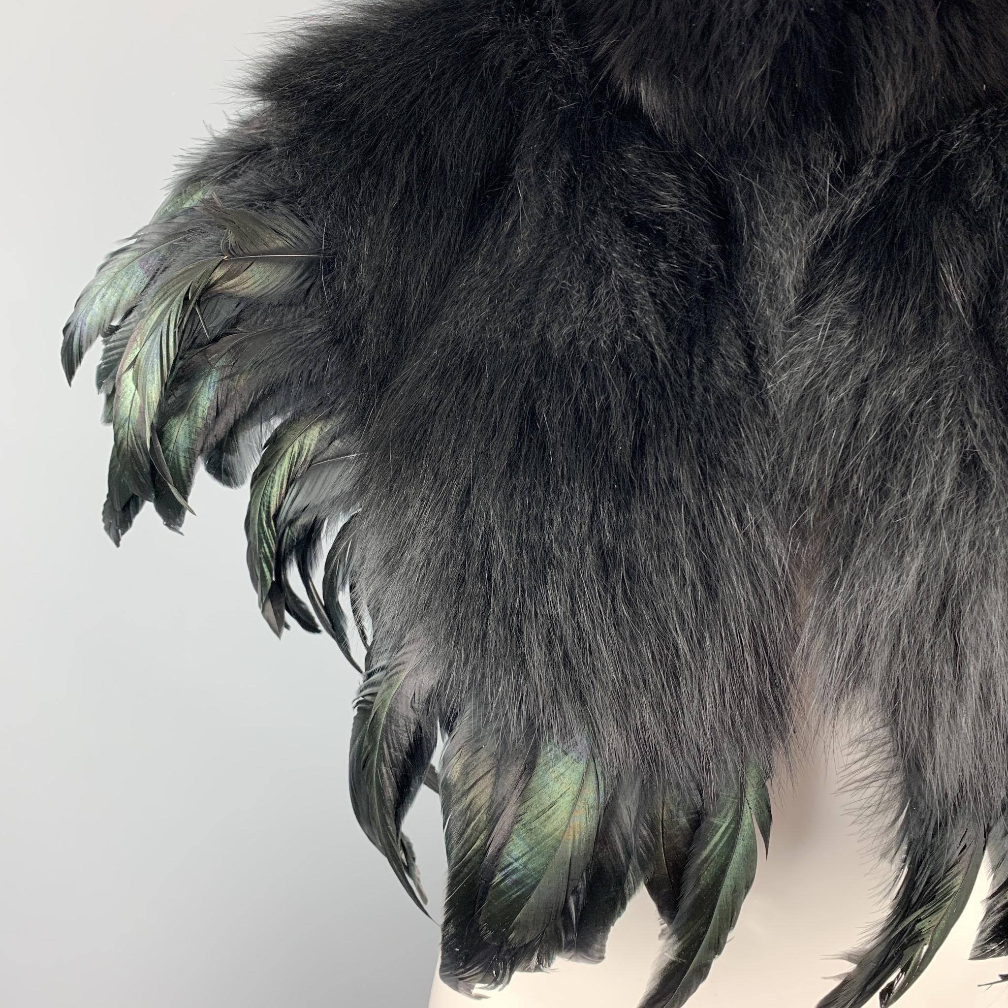 CO shawl comes in a black fox fur with green iridescent feathers featuring a black silk liner. 

Excellent Pre-Owned Condition.

Measurements:
Shoulder: 18 in. 
Length: 16 in. 

