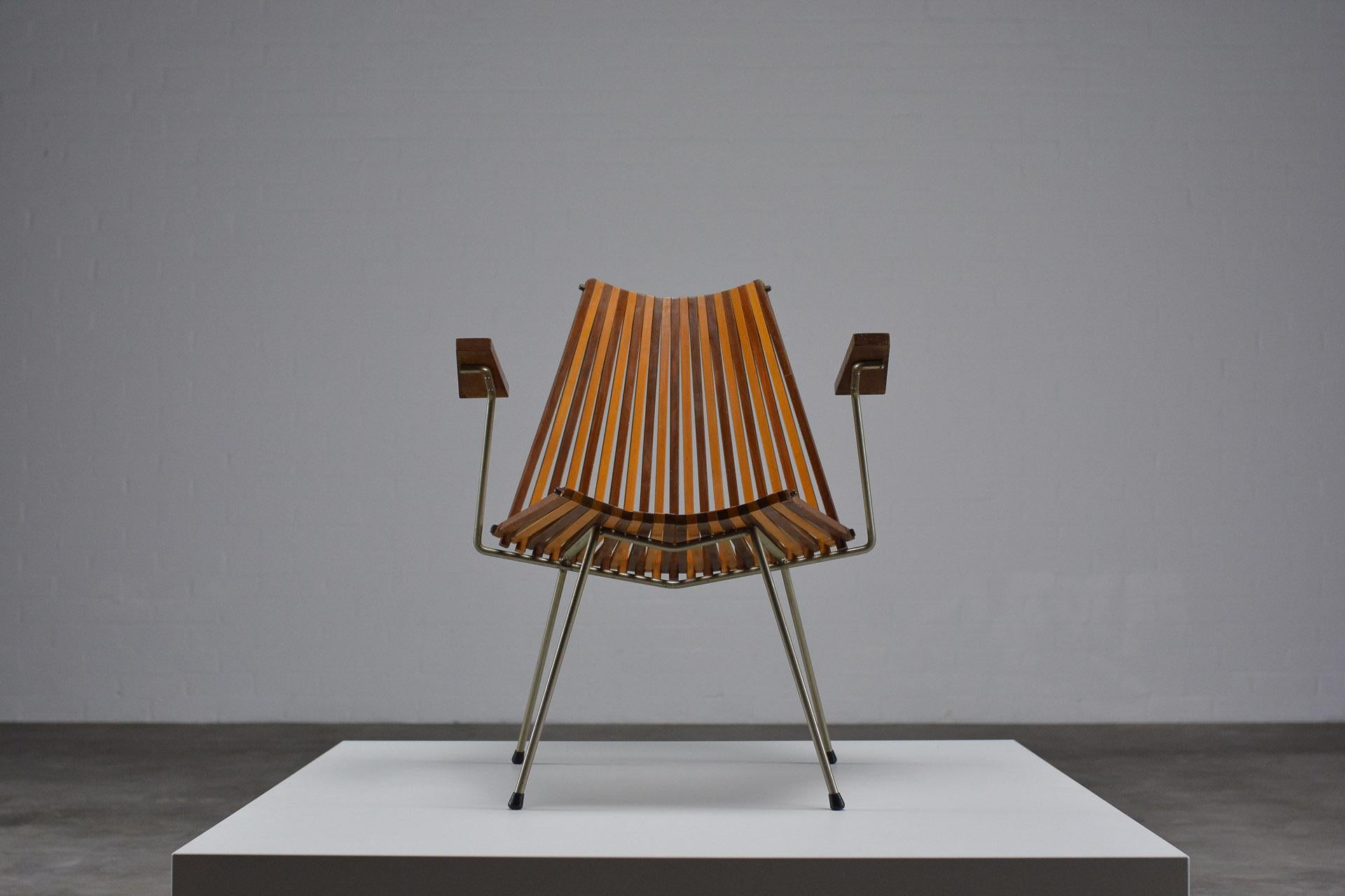 Frautuil, armchair, Dutch Design, 1960s

Designer Dirk van Sliedregt is renown for his furniture designs with rattan and steel, mainly produced by Dutch manufacturer Rohé. This lounge chair is a real eye-catcher in his oeuvre: not only because Van