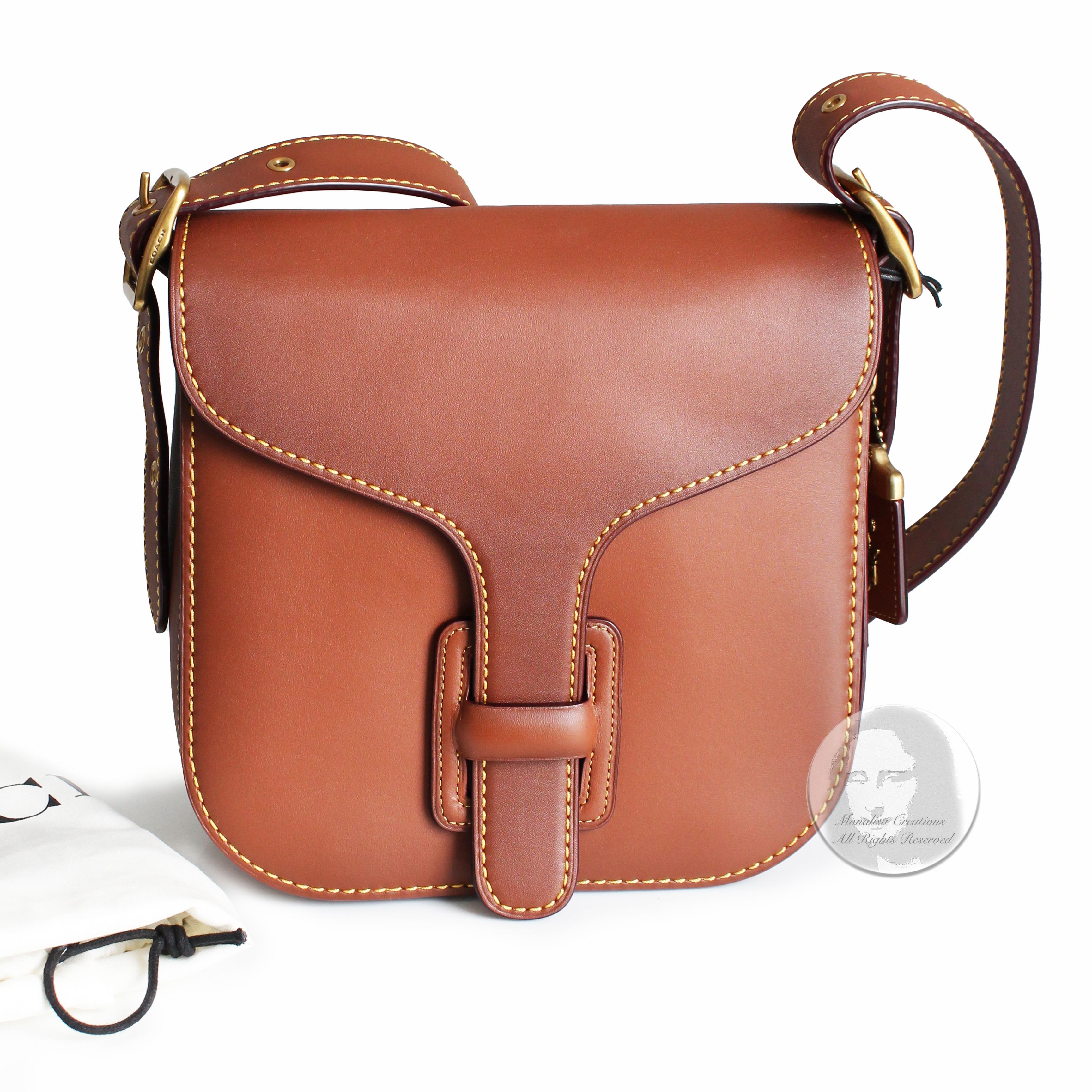 Authentic, NEW in box with tags Coach Archive Courier Bag in saddle leather, style 78805. Sold exclusively on their website as part of their 2019 Coach Originals collection.   

A Bonnie Cashin design with a rich & gorgeous color! A nod to the