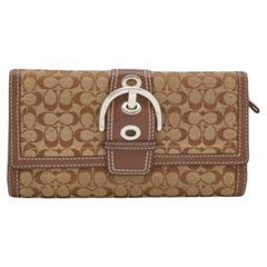 Cartera continental Coach beige/marrón con detalle de hebilla en lona y piel