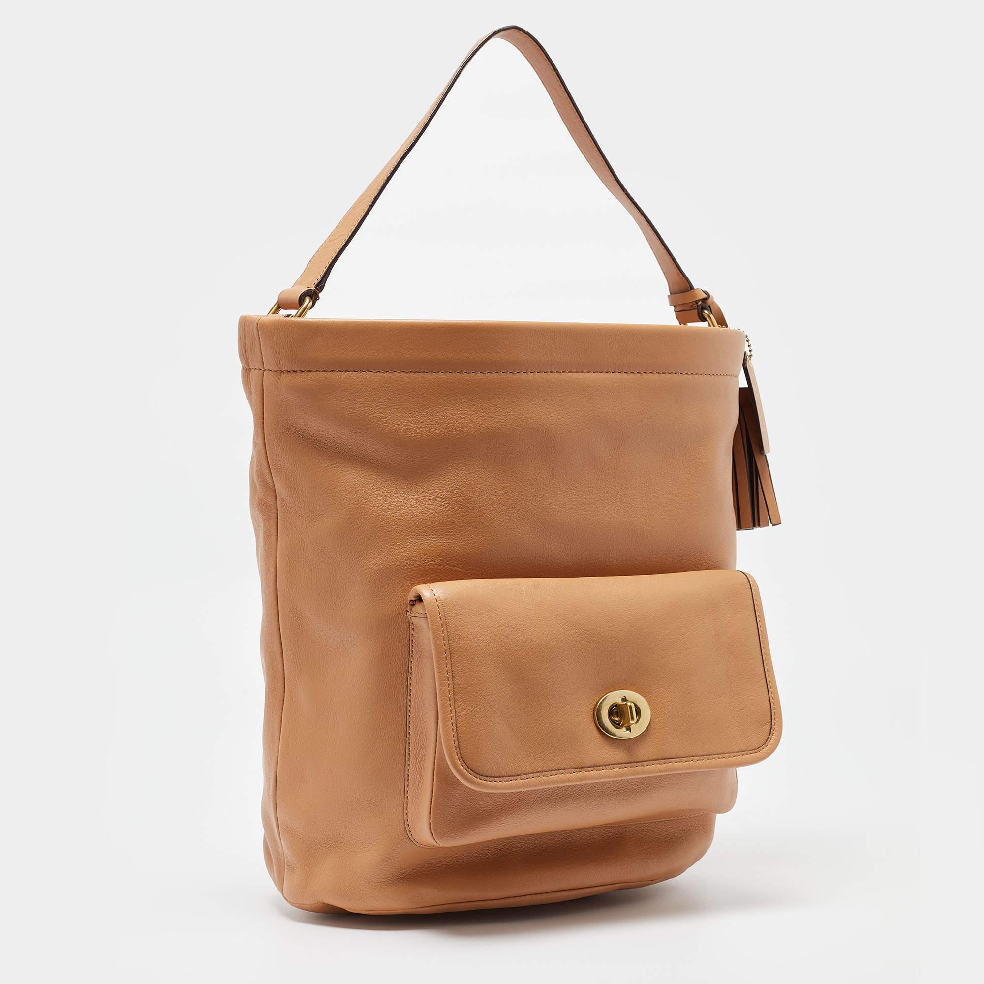 Coach Beige Leather Legacy Tassel Bucket Bag In Excellent Condition In Dubai, Al Qouz 2